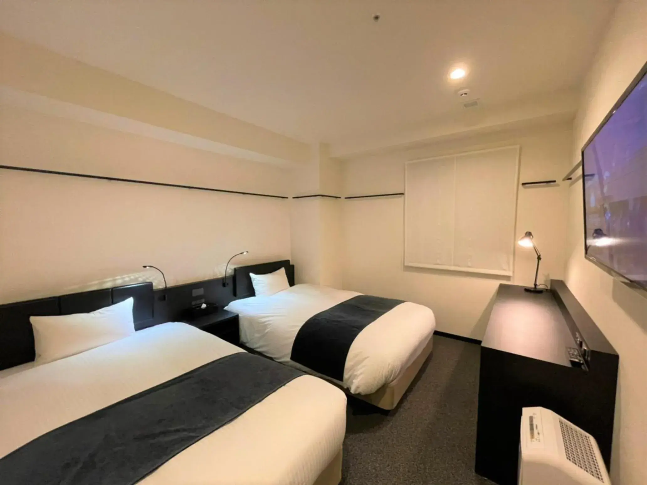 Bed in HOTEL SUI KANDA by ABEST