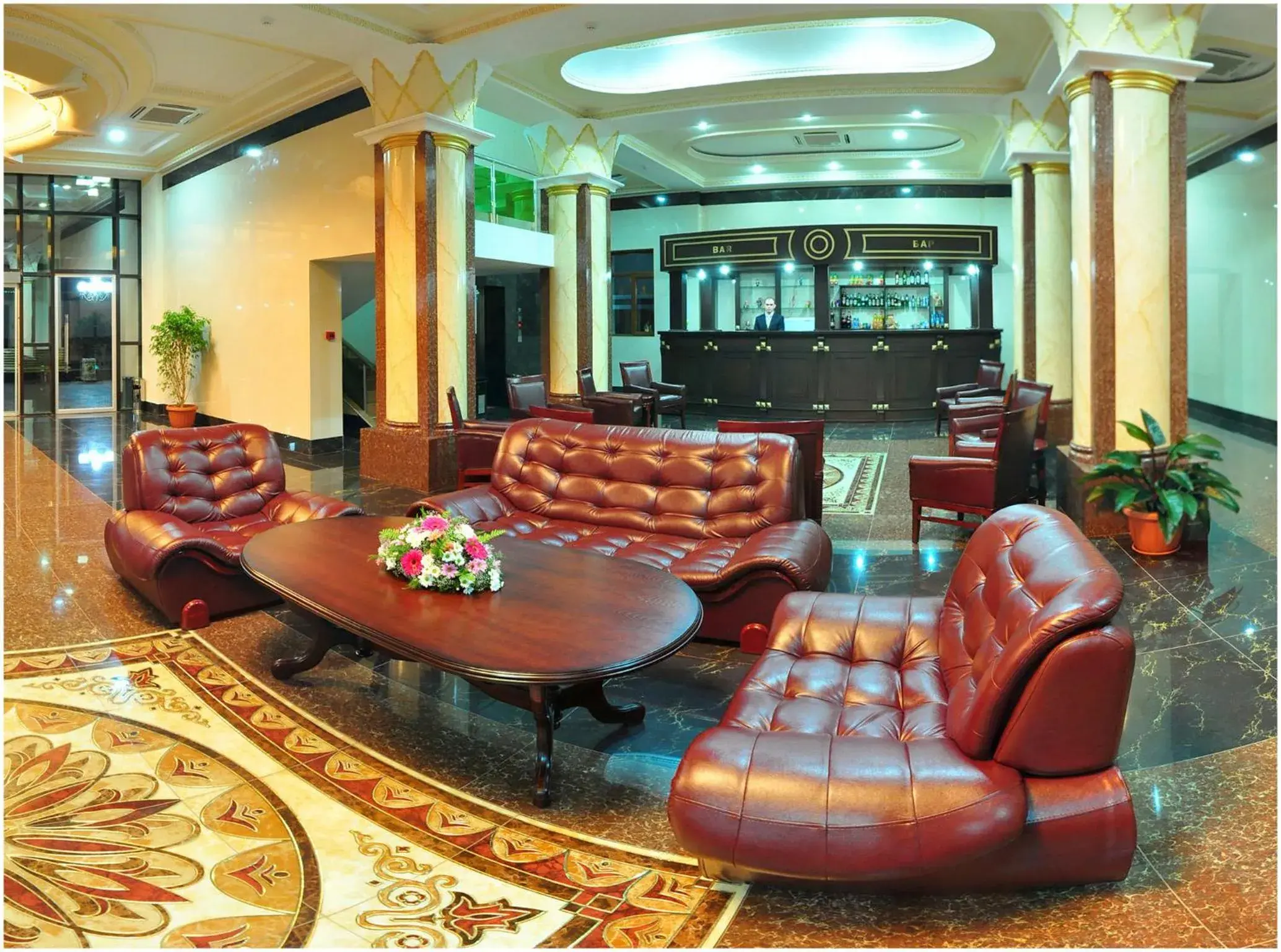 Communal lounge/ TV room, Lobby/Reception in Golden Valley Hotel