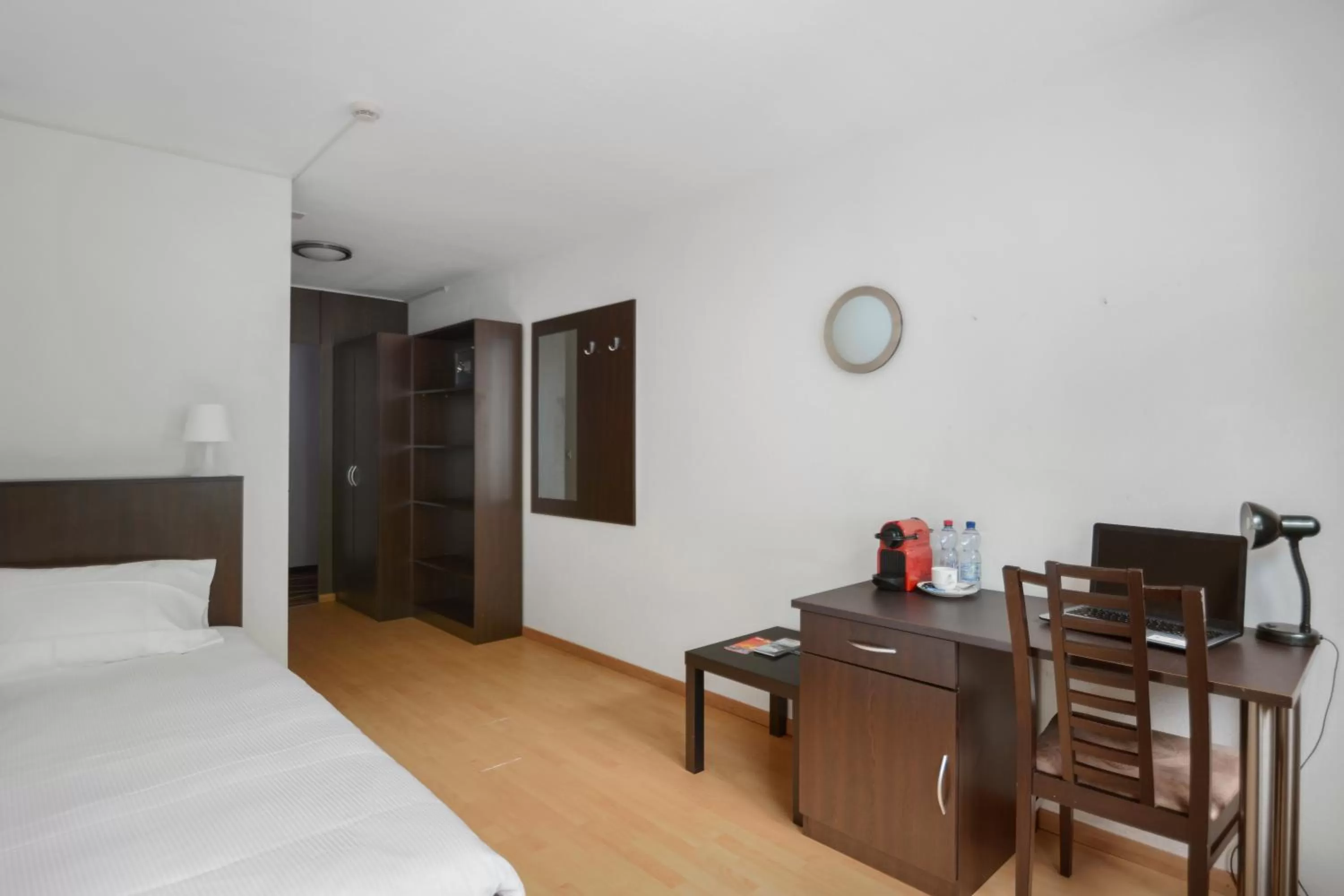 Seating area, Bed in Neuchâtel City Hôtel