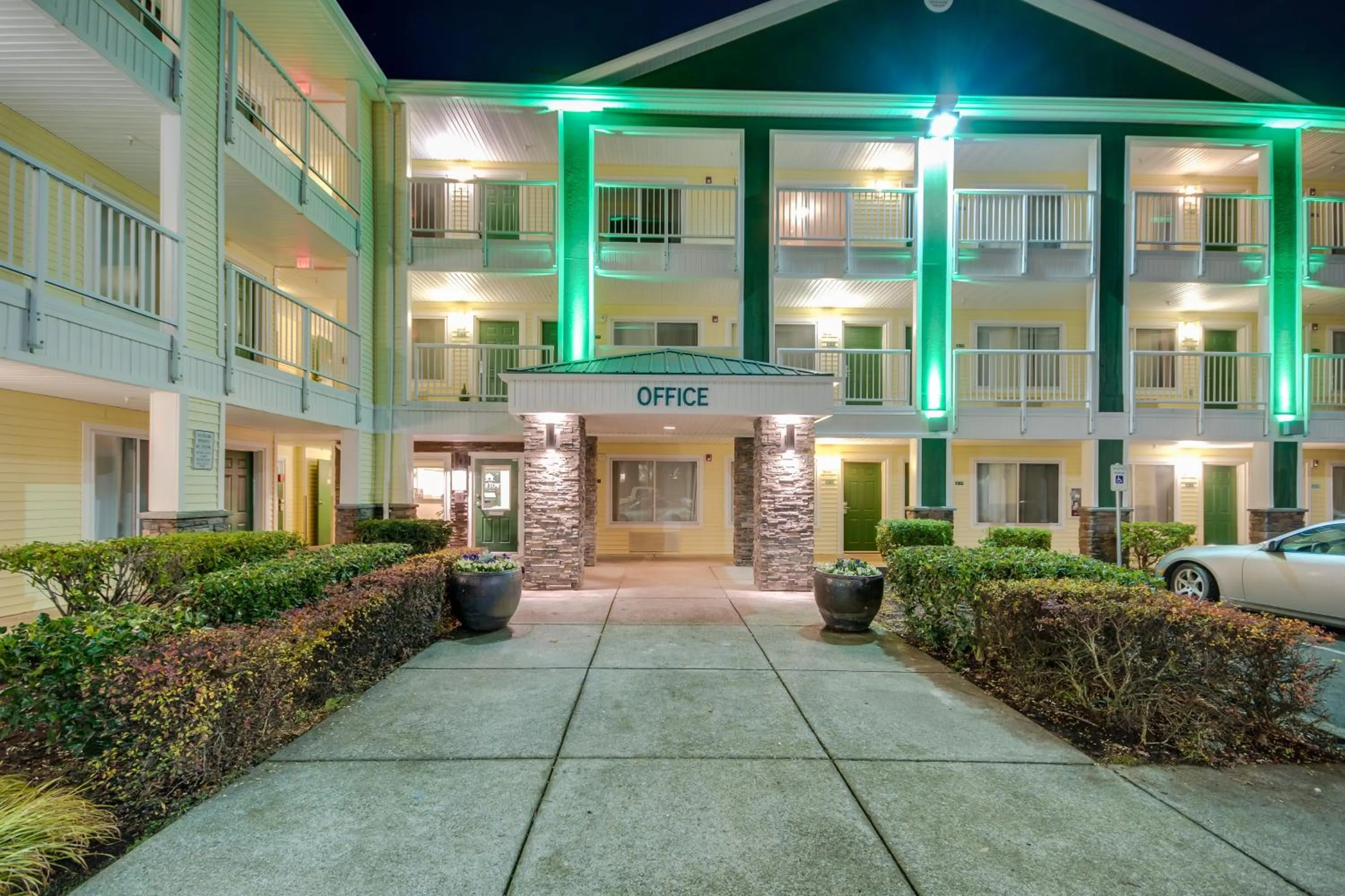 Property building in HomeTowne Studios by Red Roof Seattle - Kent/Des Moines