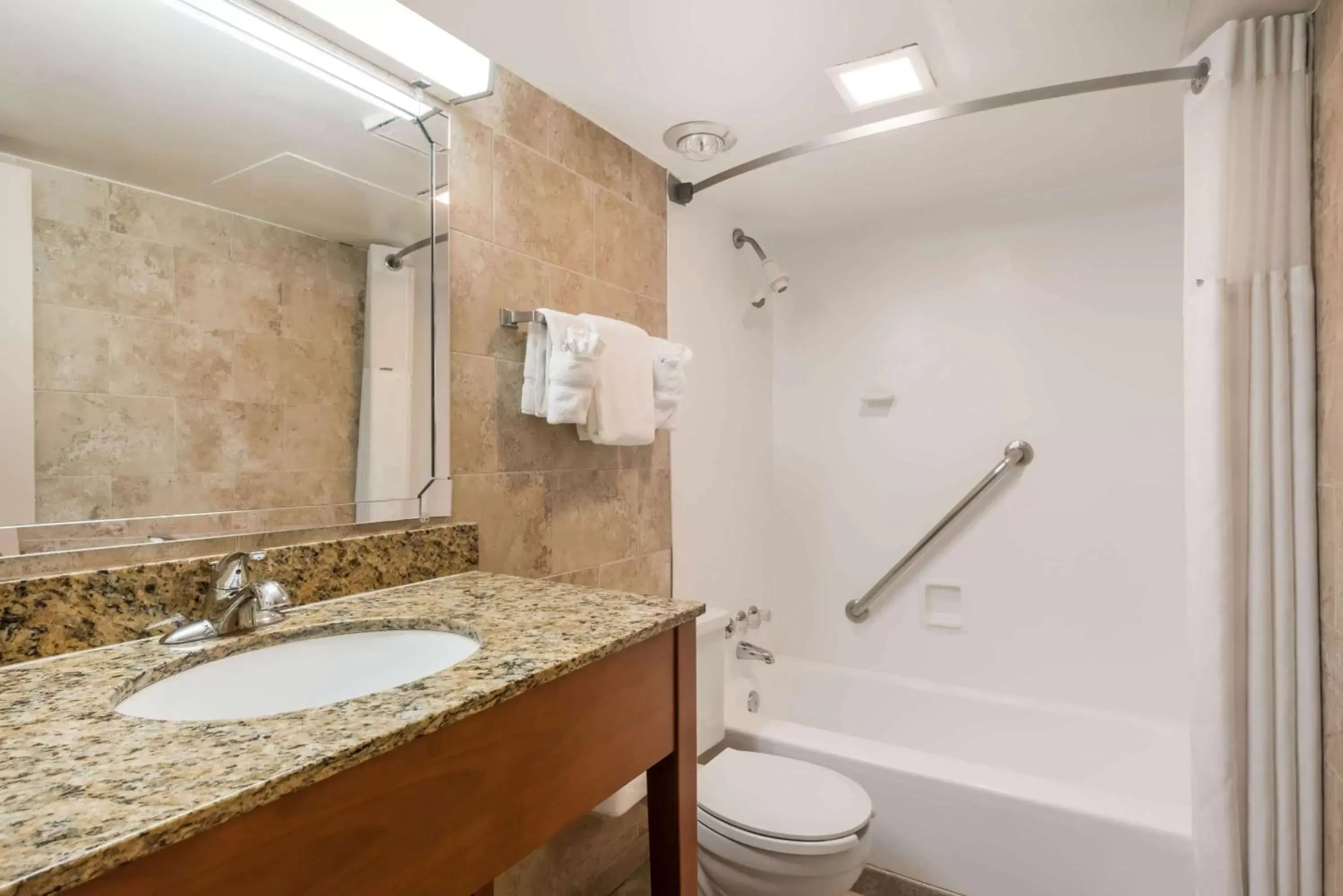 Bathroom in Ramada by Wyndham State College Hotel & Conference Center