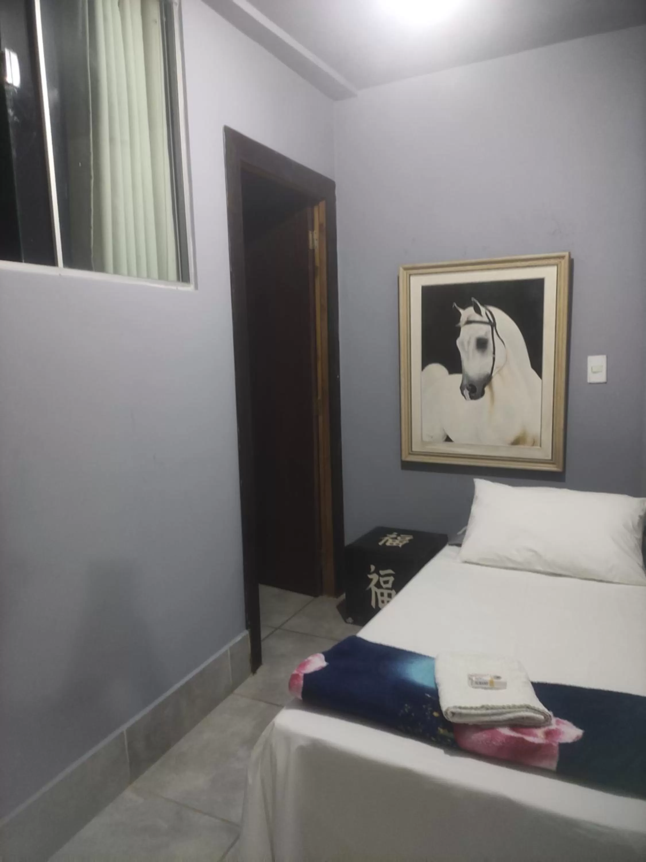 Bed in Pousada da Gi Suítes e Turismo