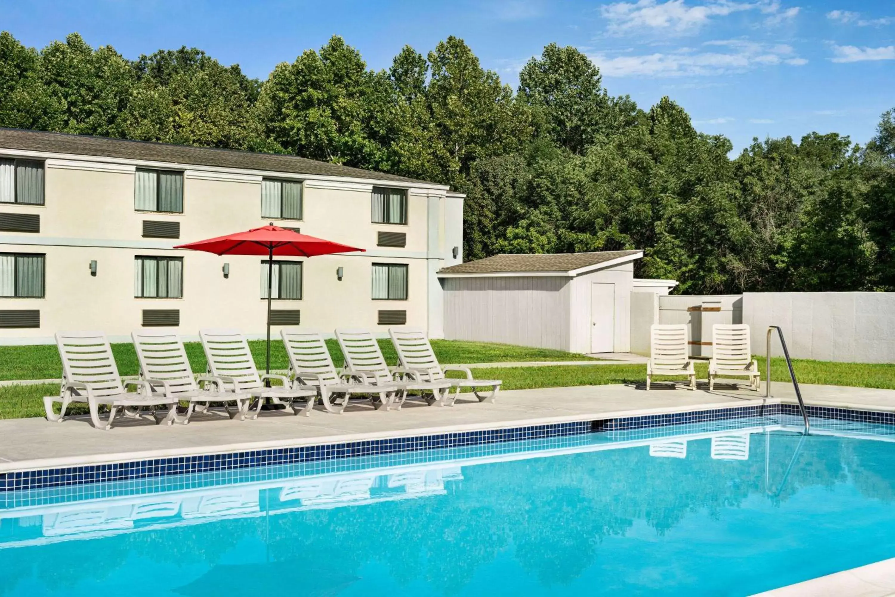 Swimming pool, Property Building in Ramada by Wyndham Whitehall/Allentown
