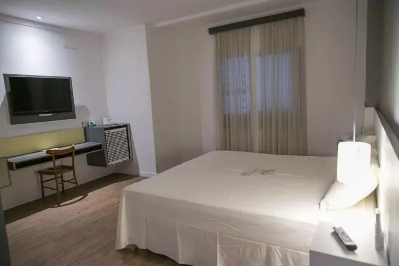 Bed in Uniclass Hotel Pinheiros