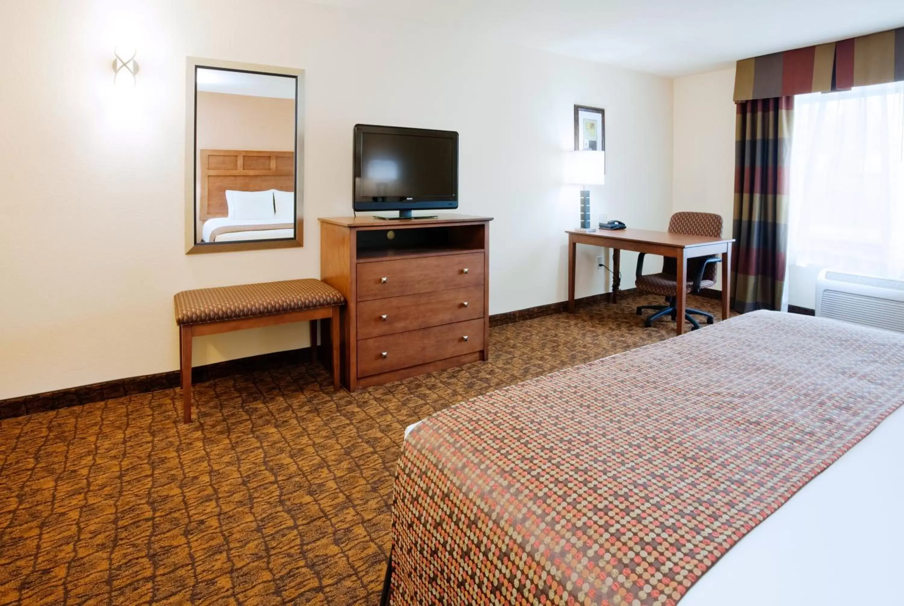 Photo of the whole room, TV/Entertainment Center in Holiday Inn Express Hotel & Suites Mount Airy, an IHG Hotel