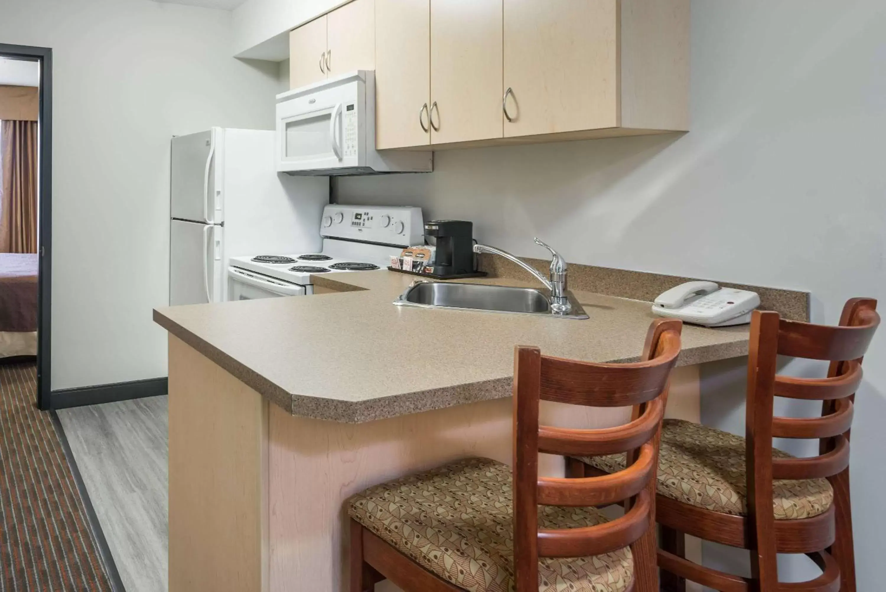 Photo of the whole room, Kitchen/Kitchenette in Super 8 by Wyndham Grande Prairie