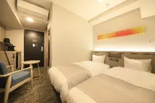 Bed in S-peria Inn Osaka Hommachi