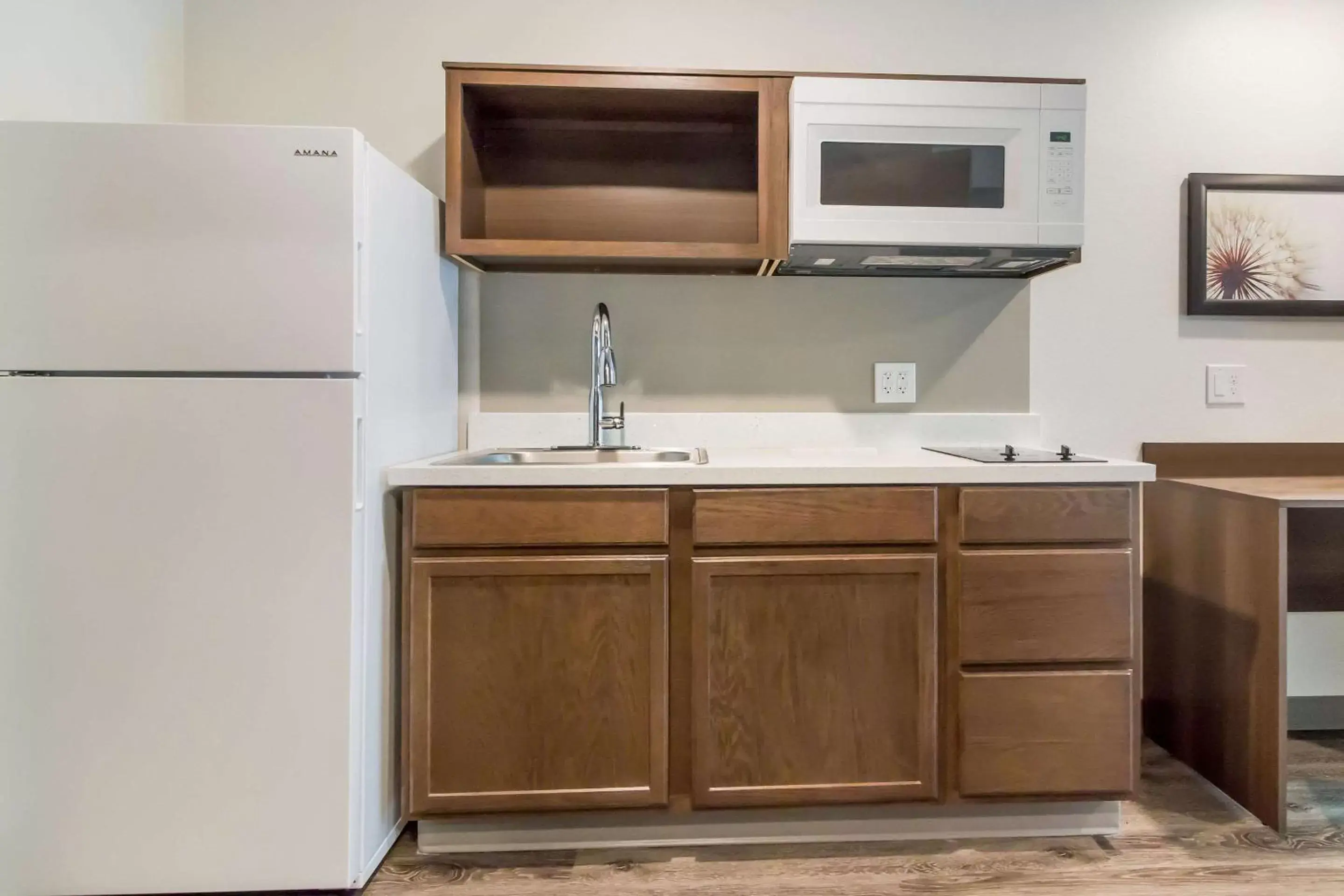 Photo of the whole room, Kitchen/Kitchenette in WoodSpring Suites Lake Jackson