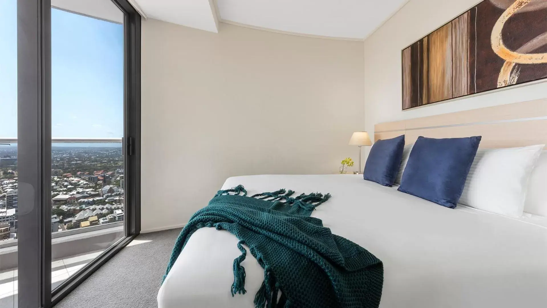 Bed in Oaks Brisbane Aurora Suites