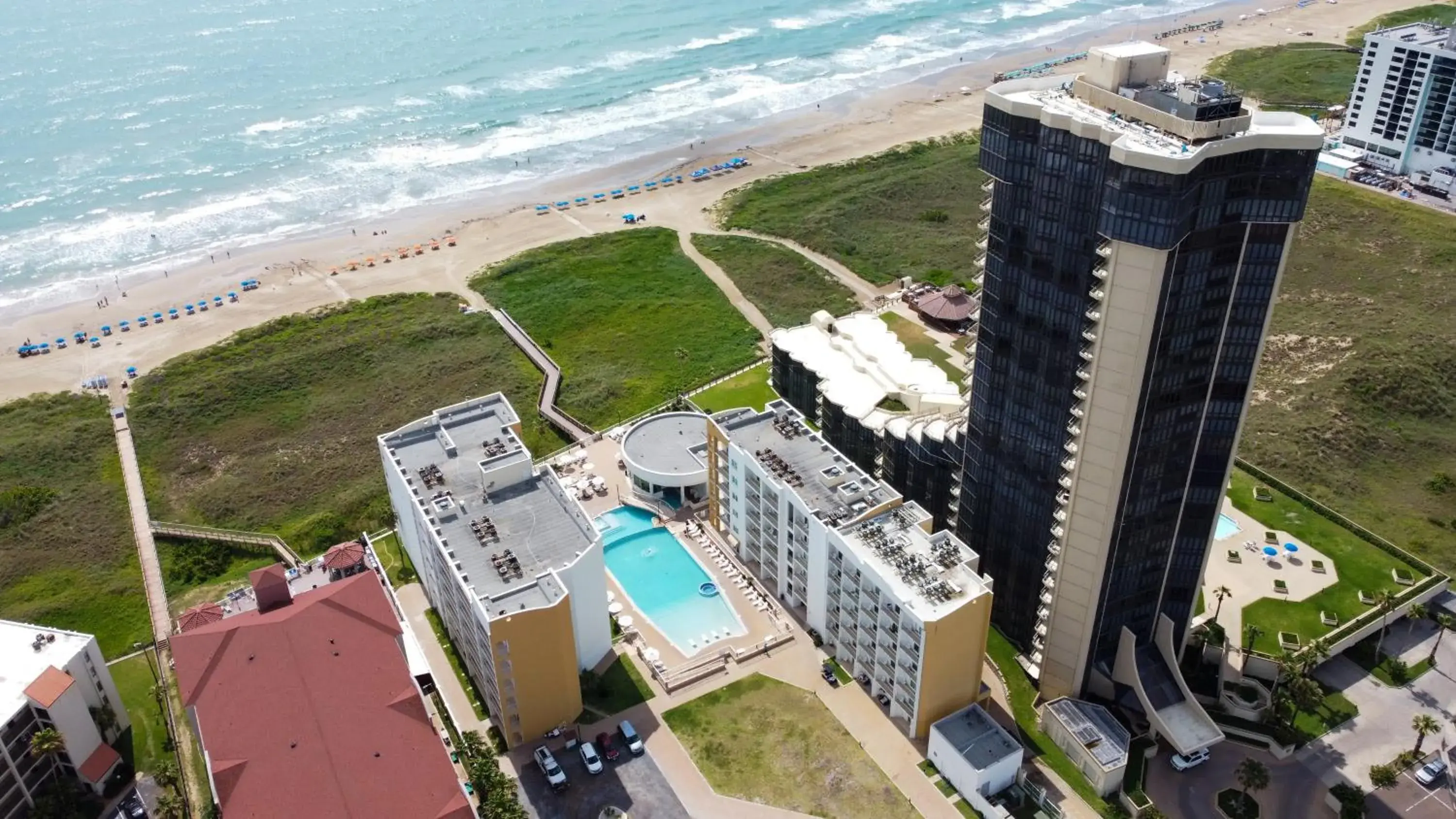 Property building in Peninsula Island Resort & Spa - Beachfront Property at South Padre Island Property building in Peninsula Island Resort & Spa - Beachfront Property at South Padre Island