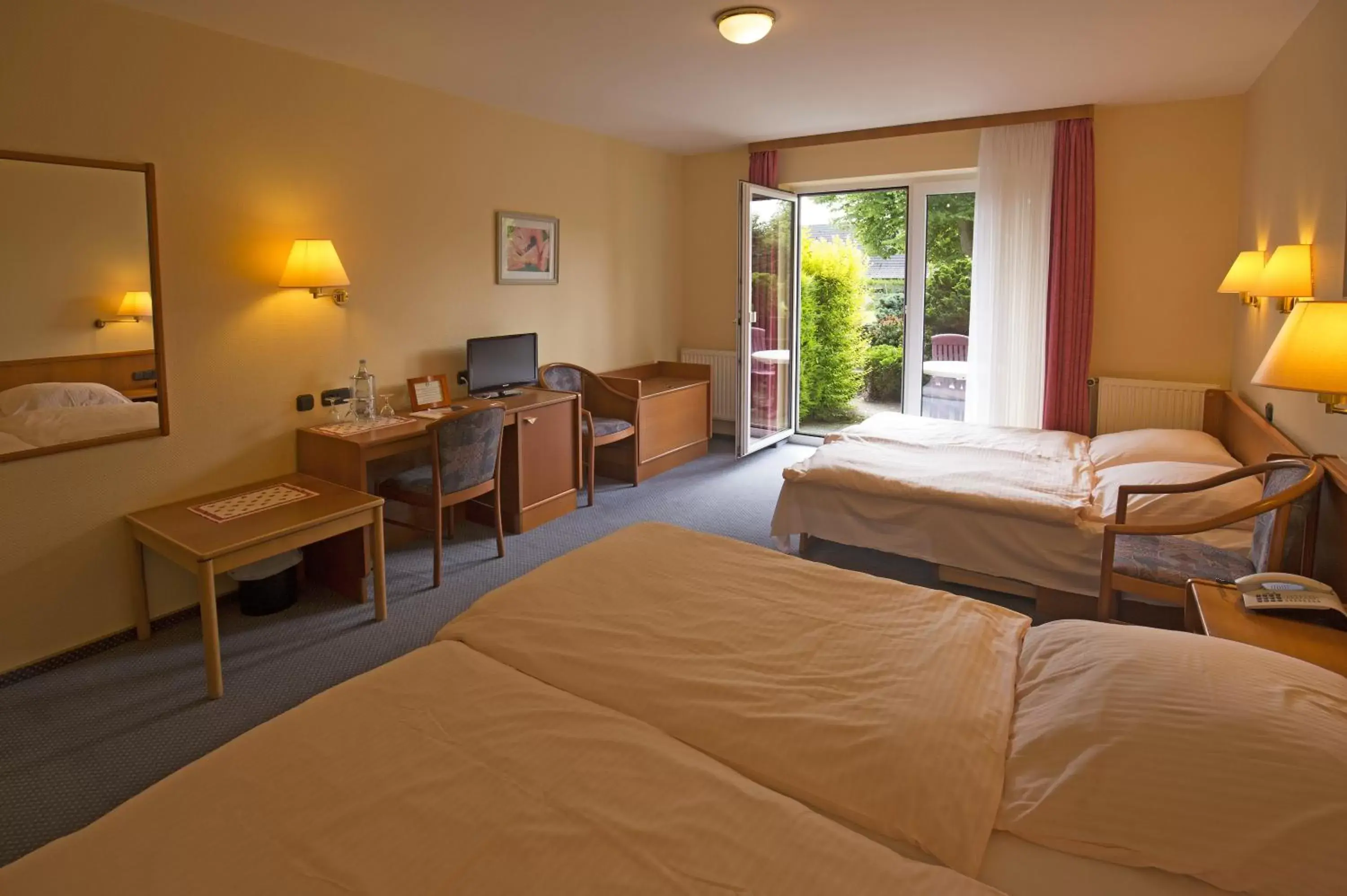 Photo of the whole room, Bed in Hotel Wittensee Schützenhof