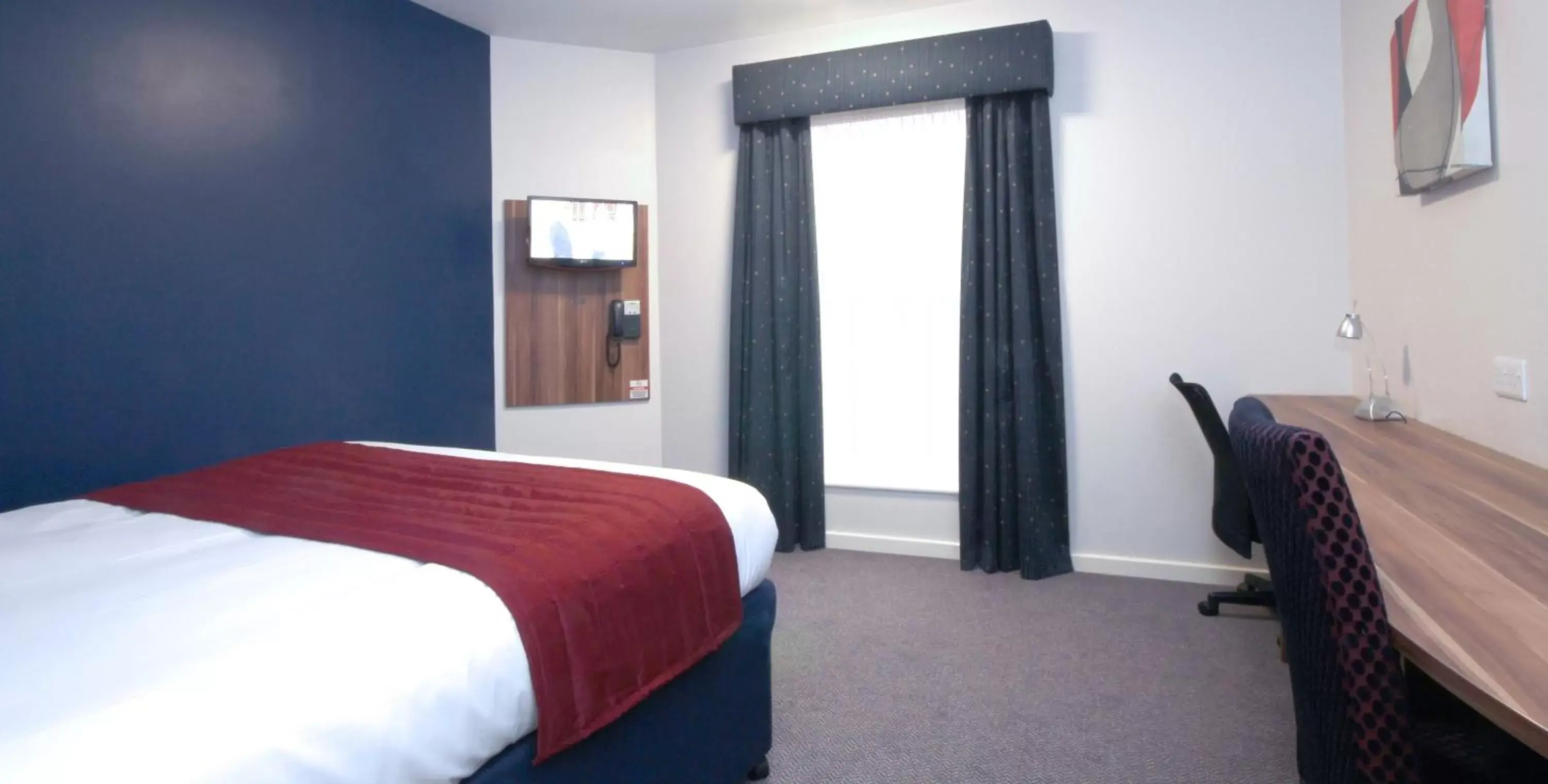 Bed in Ramada London Stansted Airport