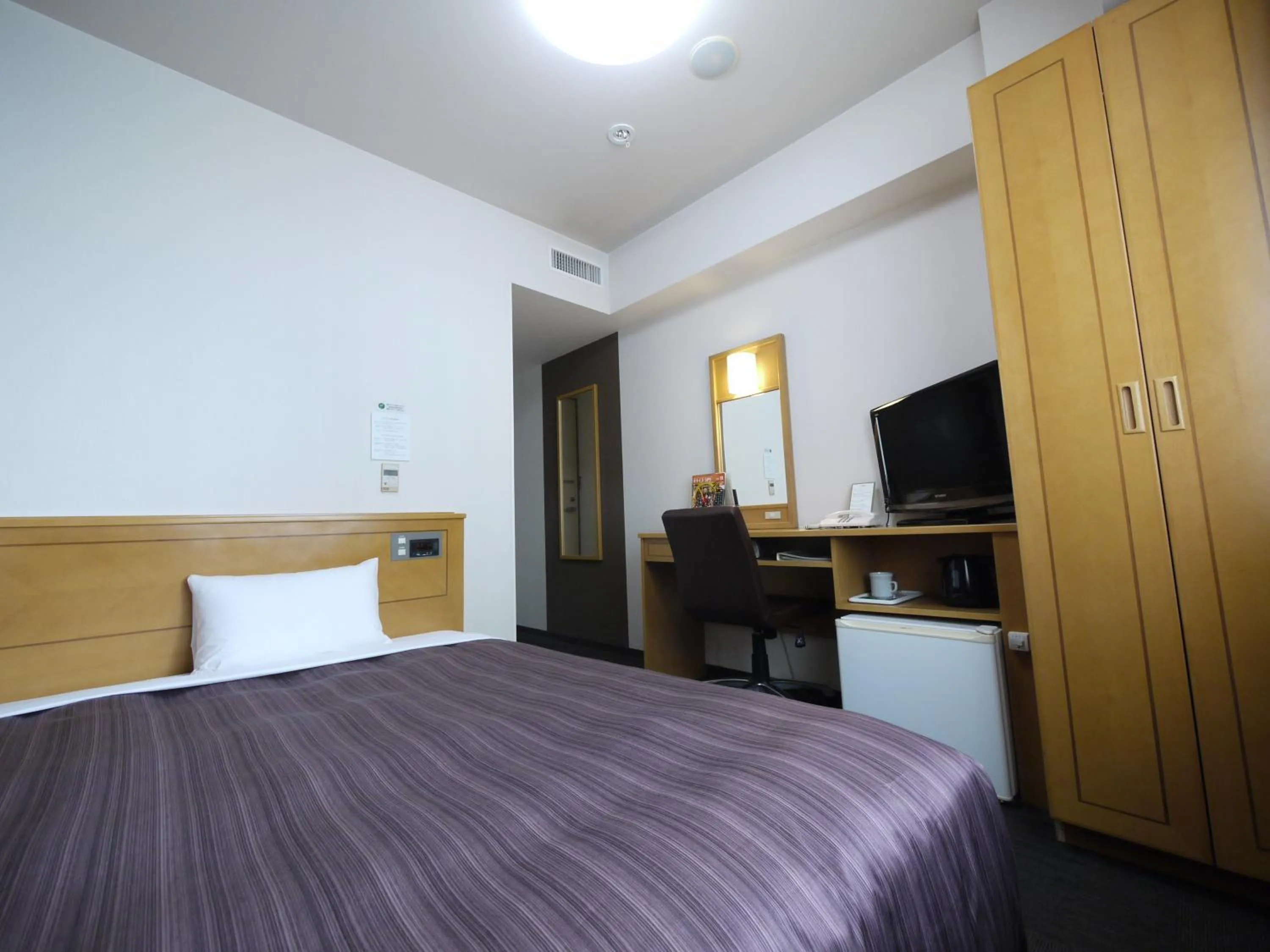 Photo of the whole room, Bed in Hotel Route-Inn Obihiro Ekimae