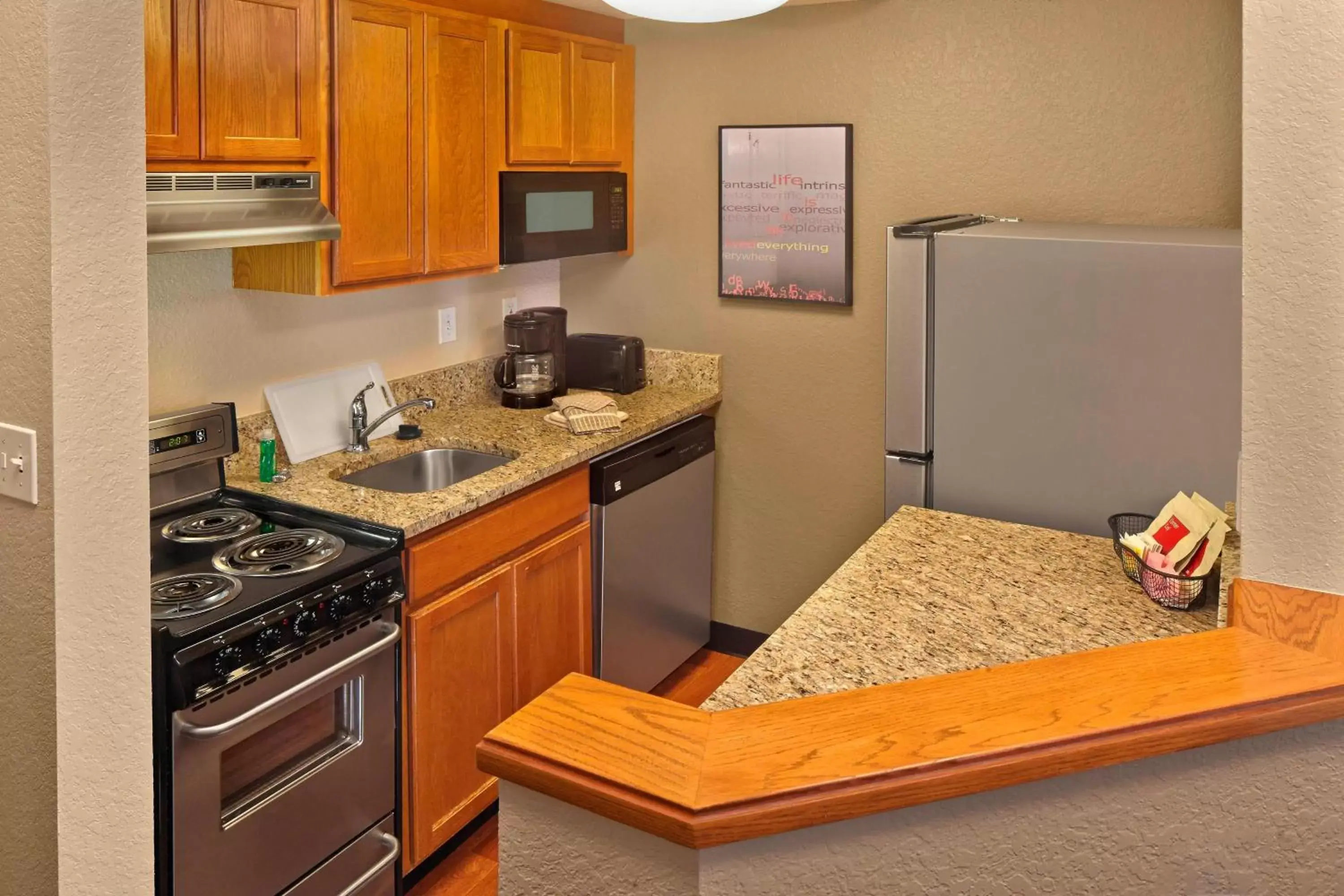 Bedroom, Kitchen/Kitchenette in TownePlace Suites by Marriott Orlando East/UCF Area