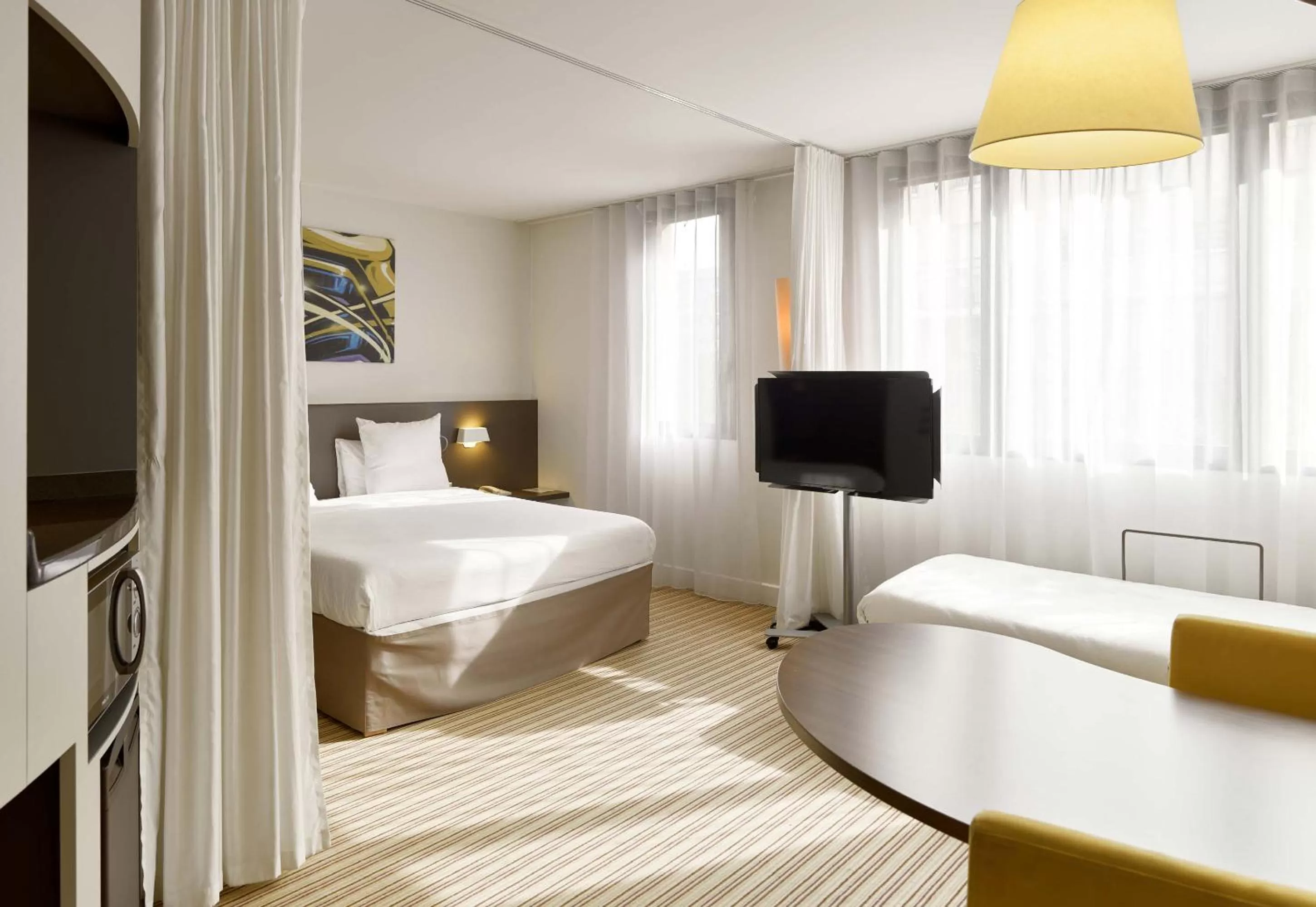 Photo of the whole room, Bed in Novotel Suites Paris Rueil Malmaison