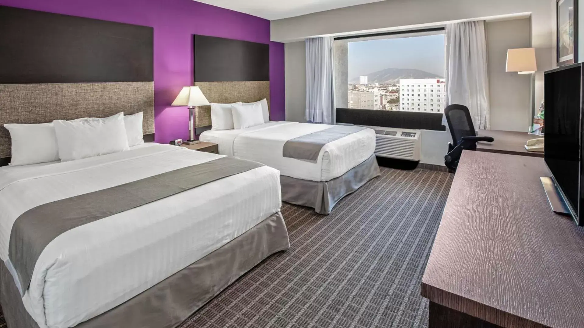 Property building, Bed in CHN Hotel Monterrey Centro, Trademark Collection by Wyndham