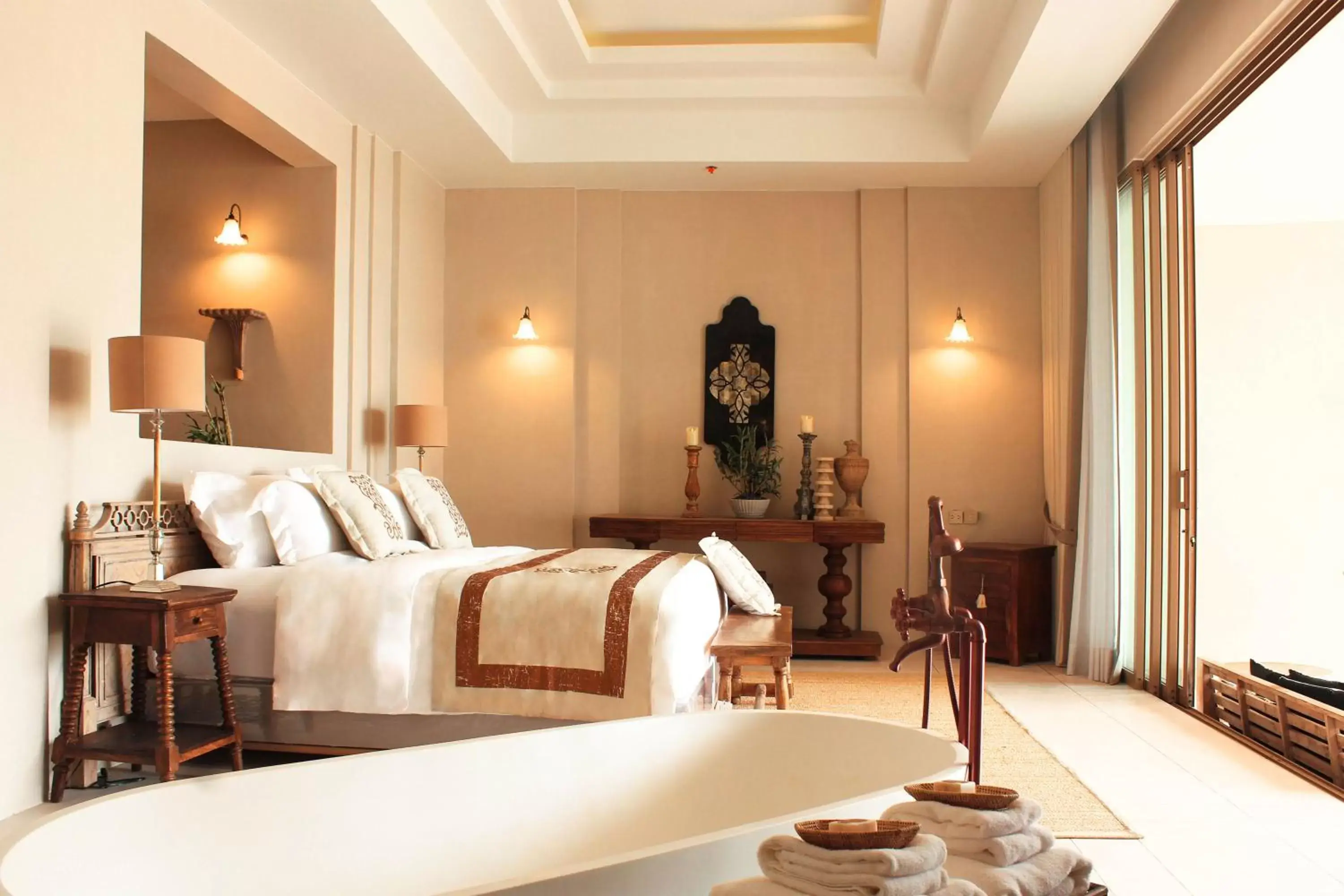 Bed in Devasom Khao Lak Beach Resort & Villas