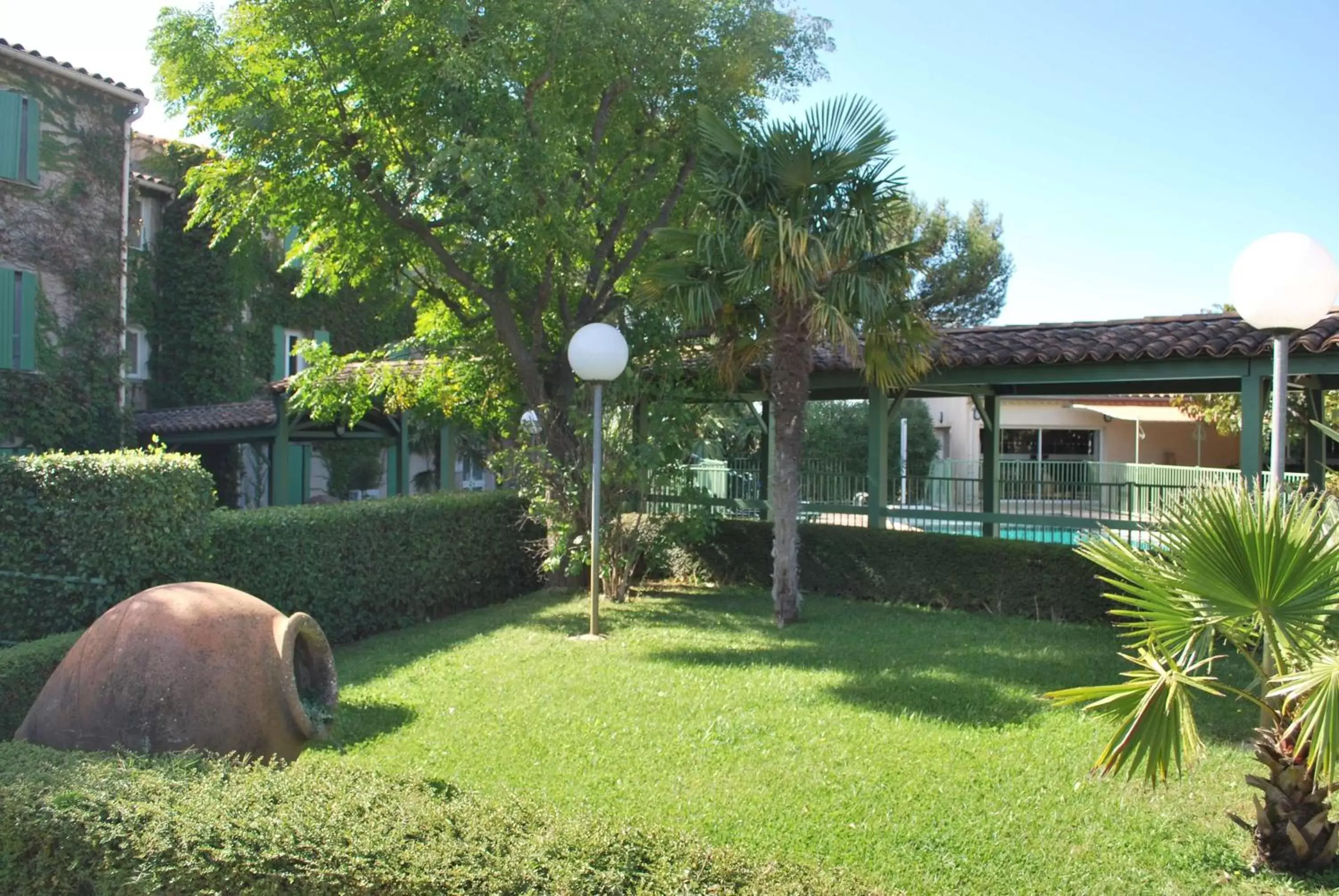 Property building, Garden in Logis Hotel Restaurant Uzès Pont du Gard