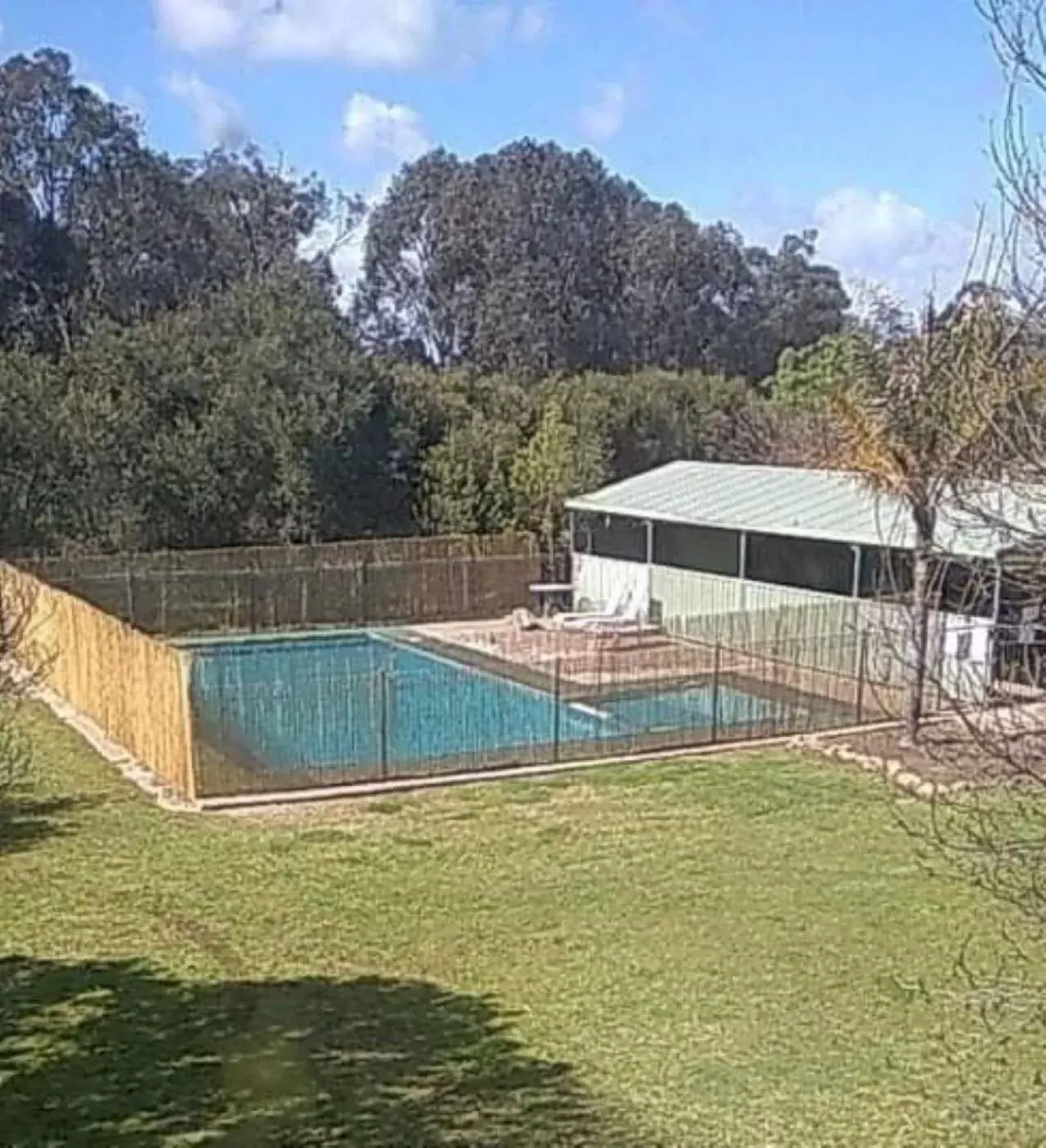 Swimming pool in Allonville Gardens Motel