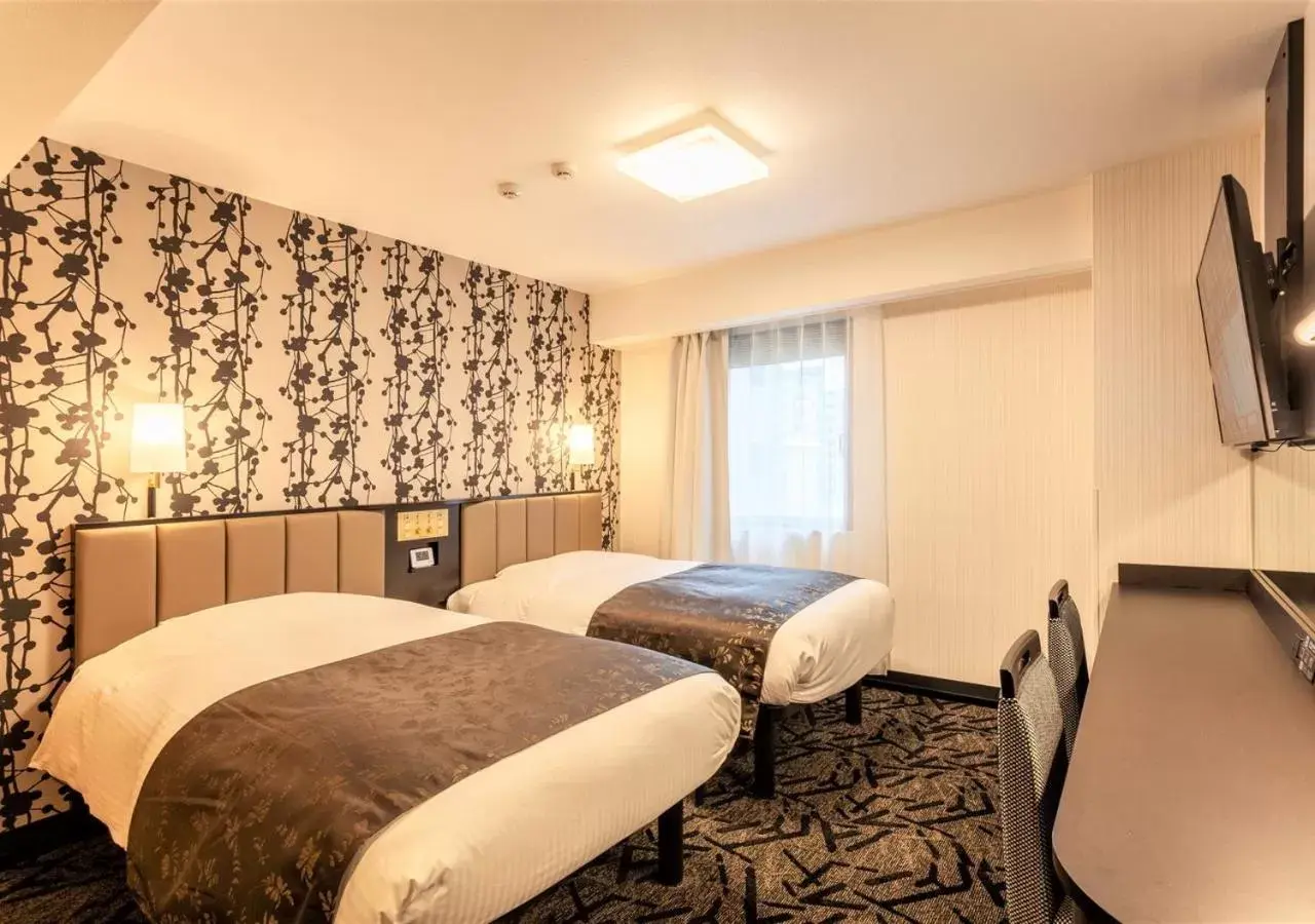 Bed in APA Hotel Saga Ekimae Chuo