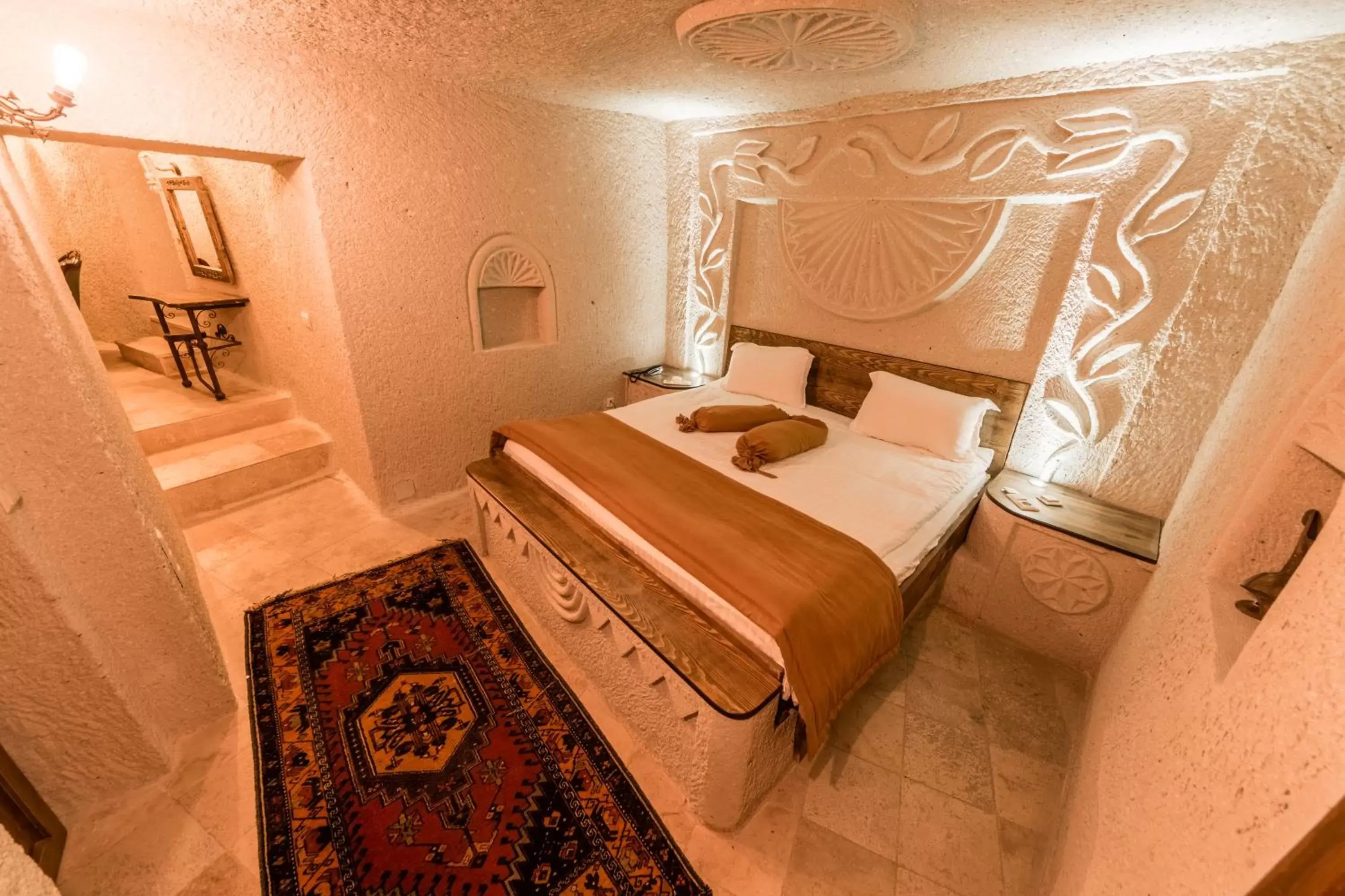 Bed in Elite Cave Suites