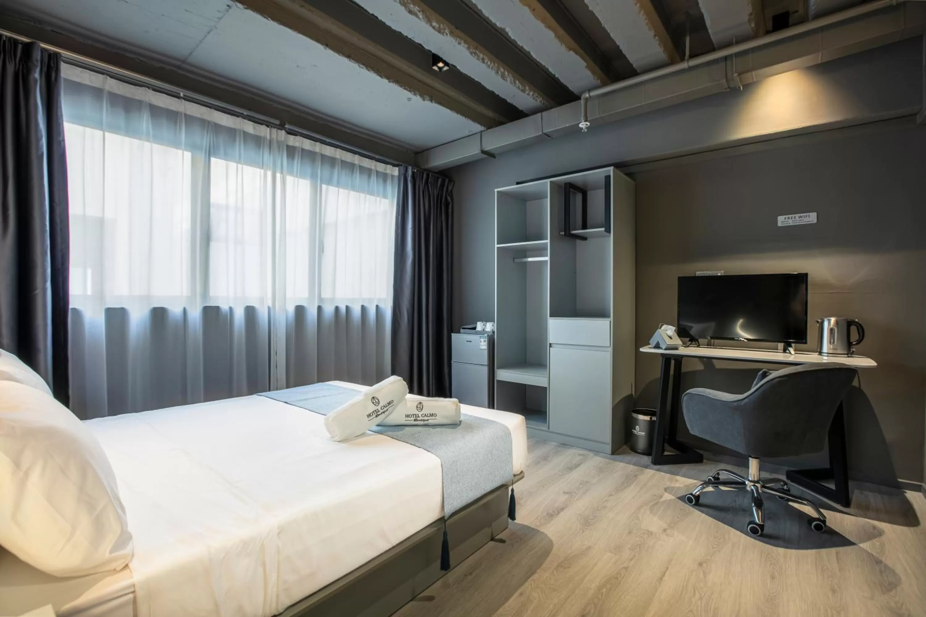 Bed in Hotel Calmo Bugis