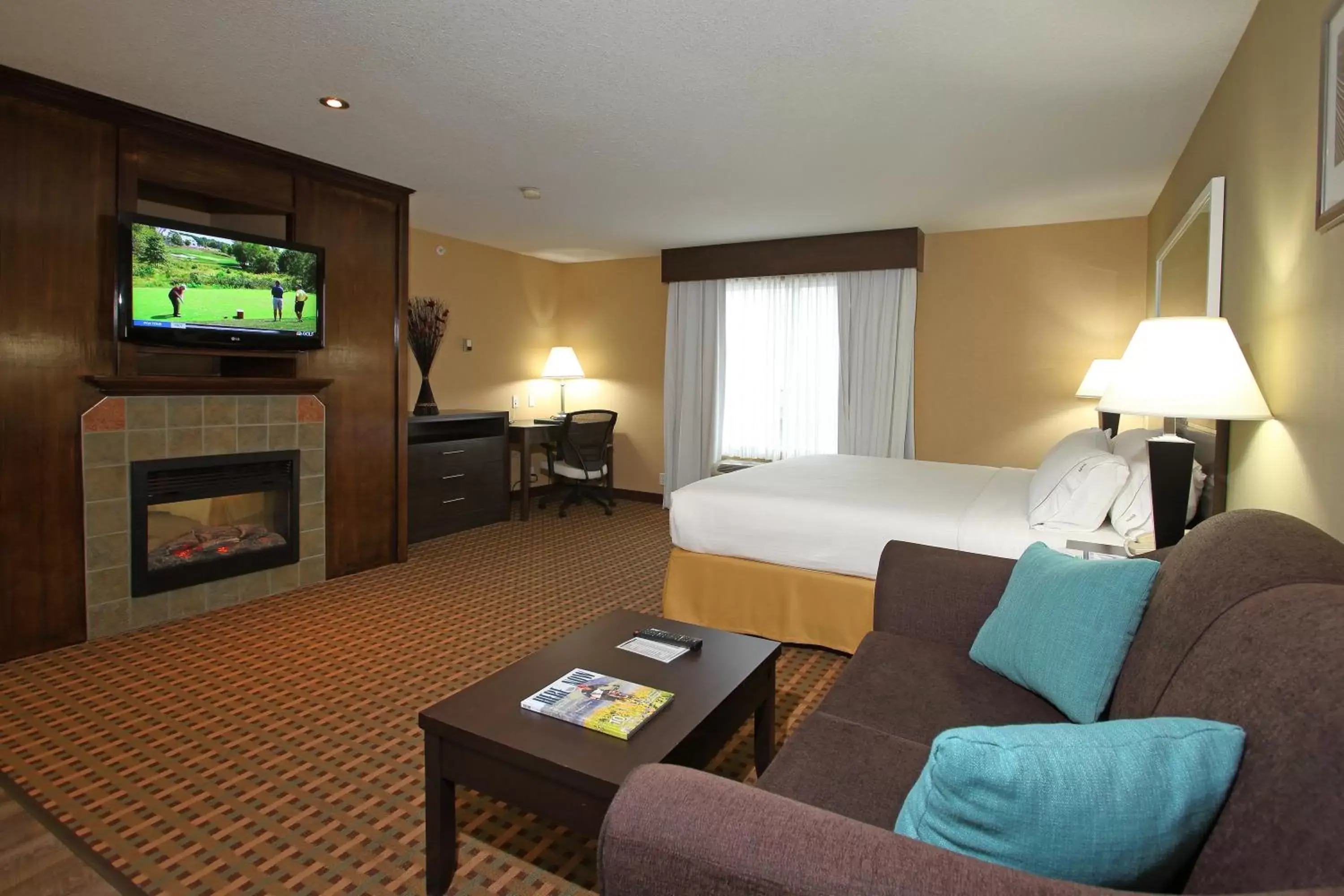 Photo of the whole room, TV/Entertainment Center in Holiday Inn Express Hotel & Suites Vernon, an IHG Hotel