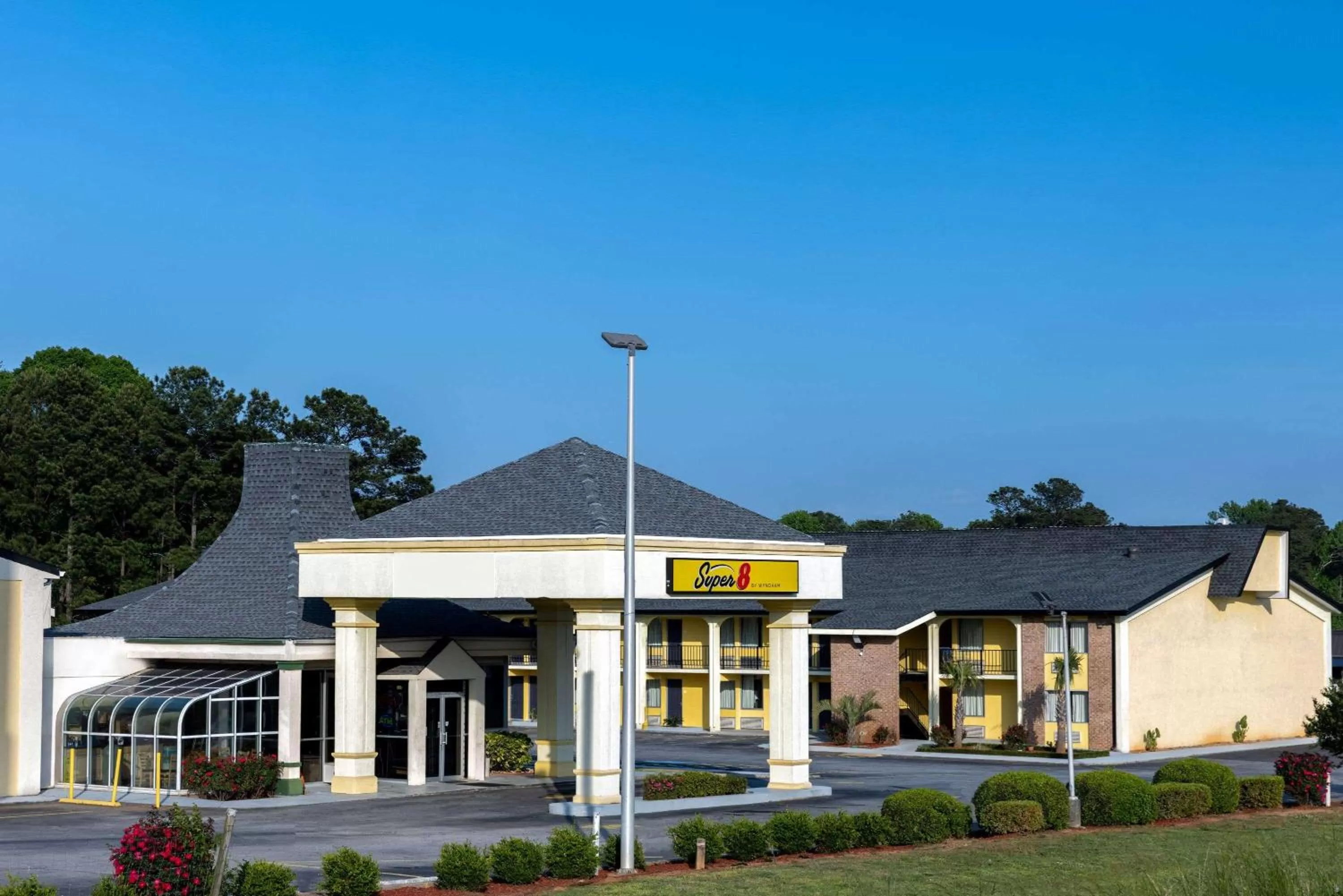 Property building in Super 8 by Wyndham McDonough GA