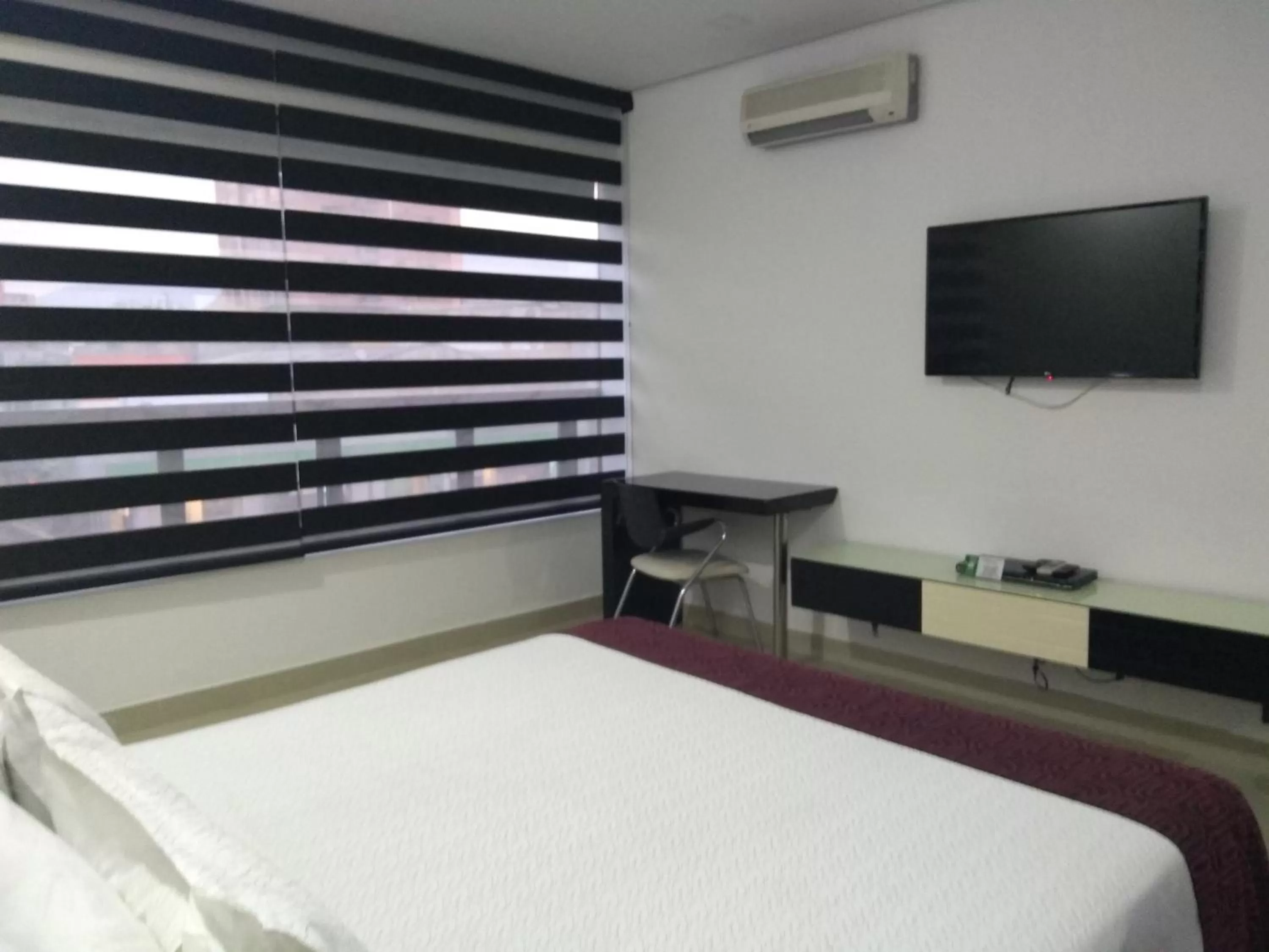 Photo of the whole room, Bed in Hotel Merlott 70