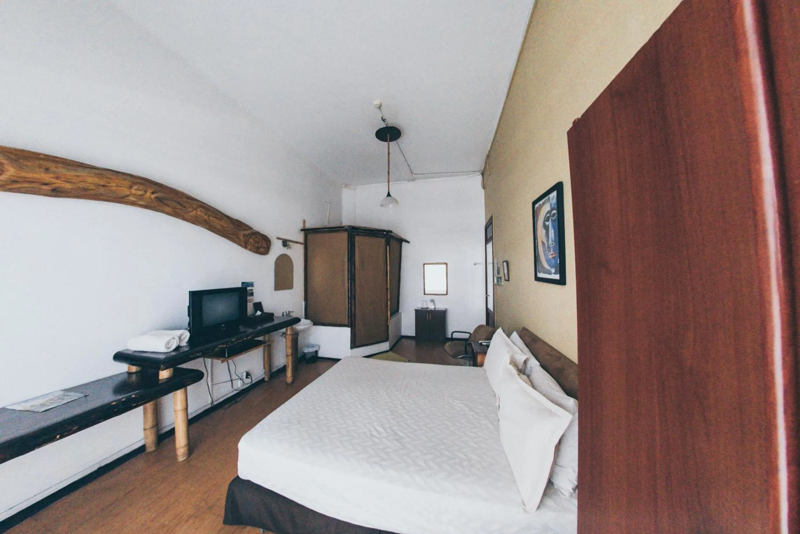 Bedroom, TV/Entertainment Center in Manso Boutique Guest House