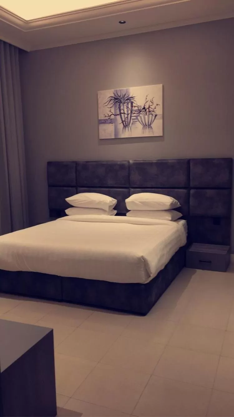 Bed in Voyage Apartments