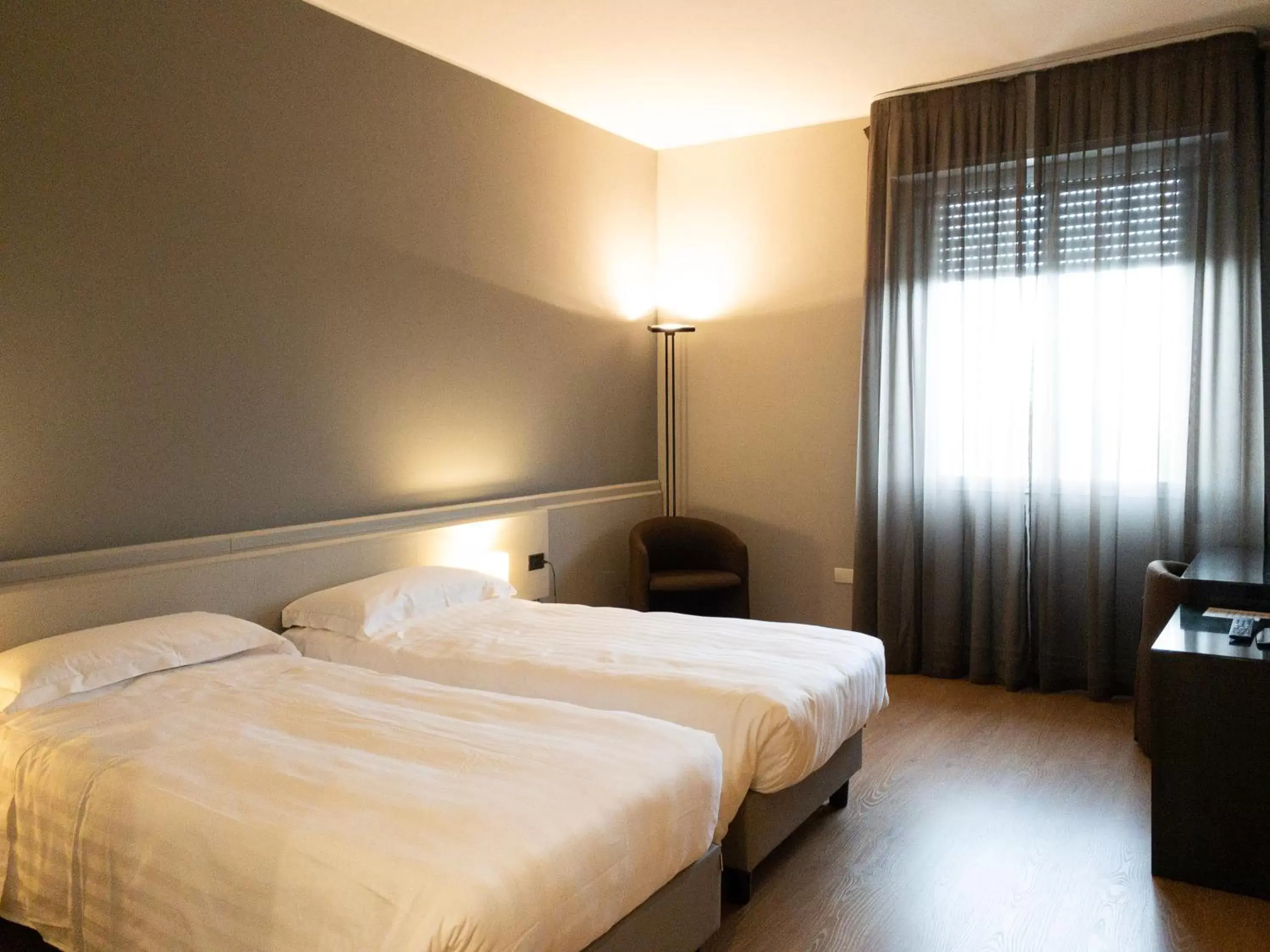 Bed in Helios Hotel & Restaurant