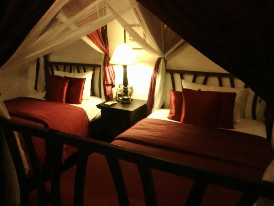 Bed in Tri Yaan Na Ros Colonial House