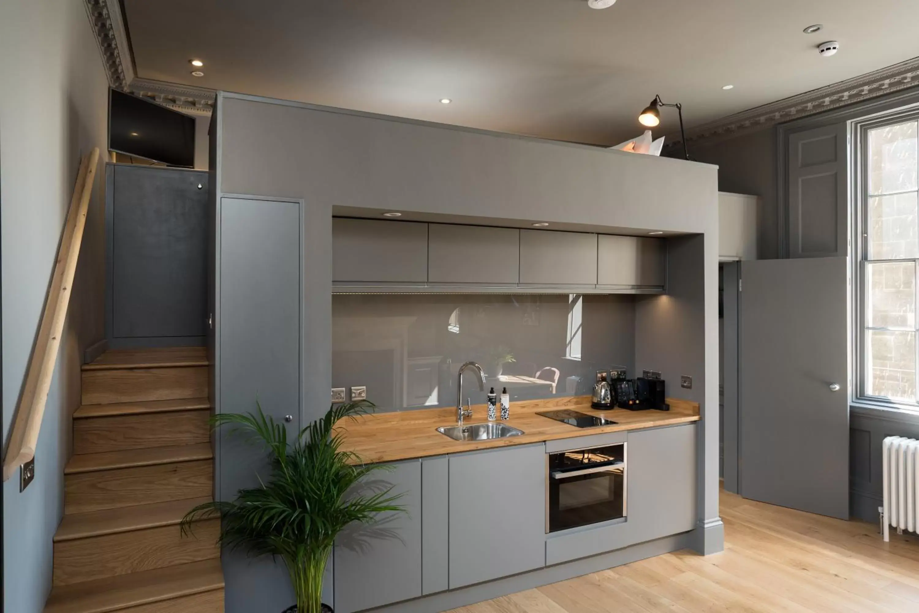 Kitchen/Kitchenette in Hiding Space - Trim Street Apartments