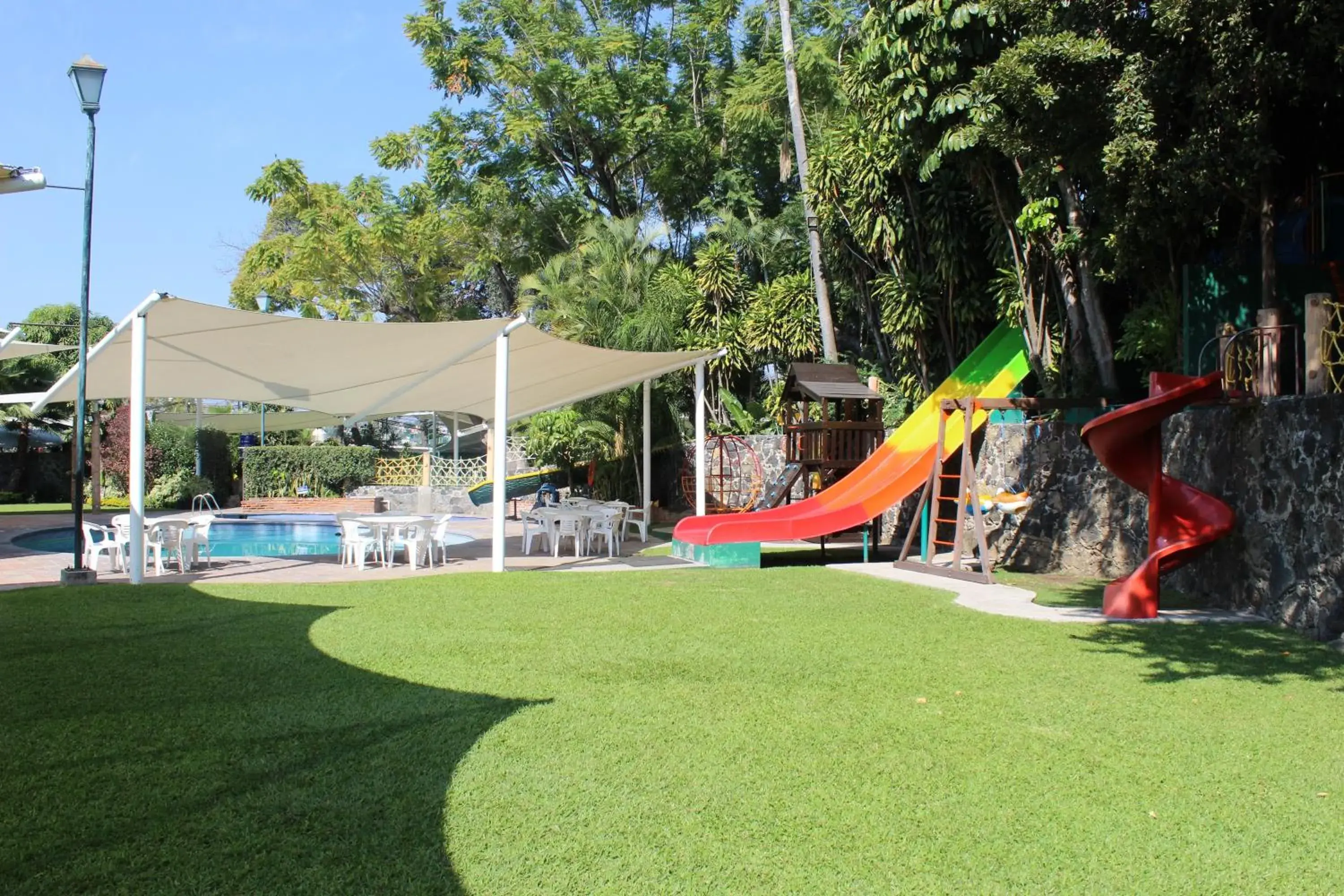 Children play ground, Swimming Pool in Hotel Coral Cuernavaca Resort & Spa