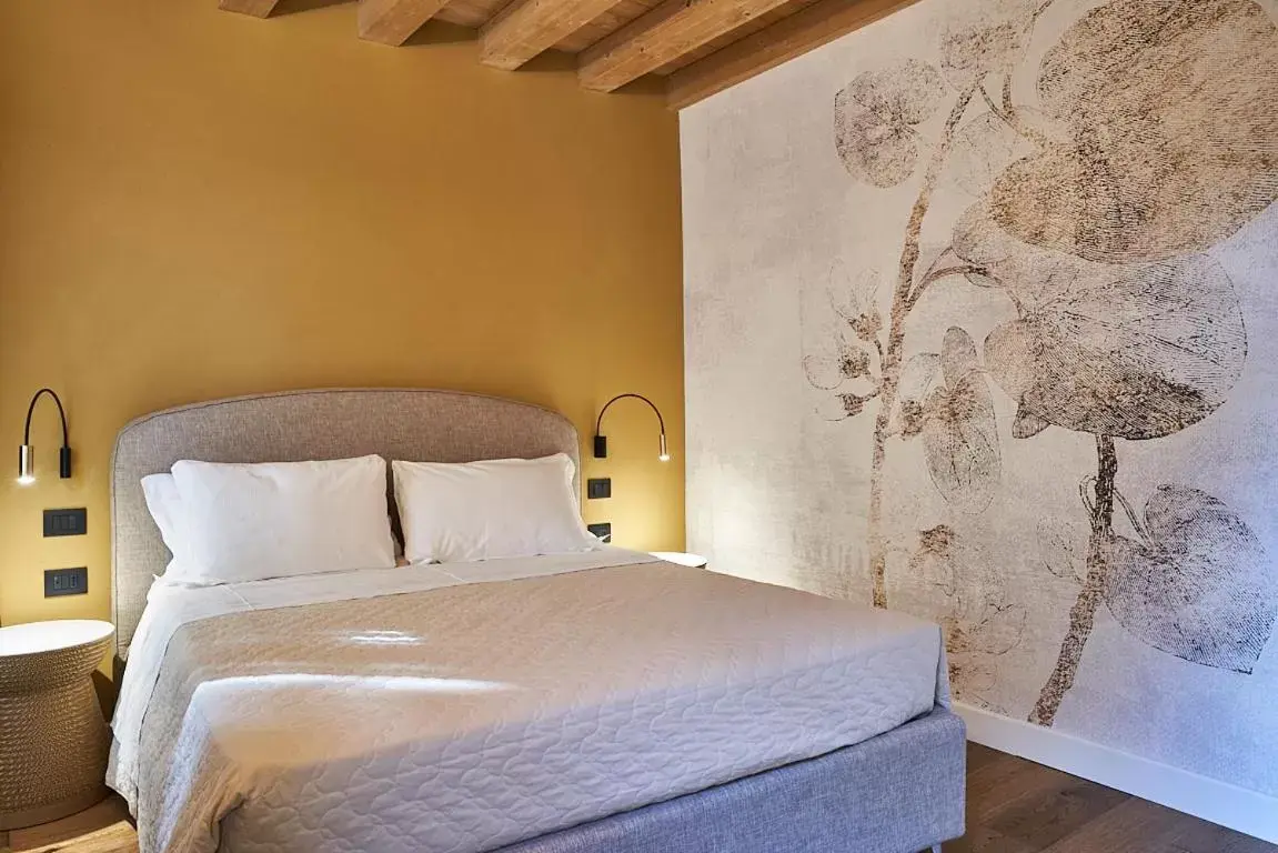 Bed in Locanda delle Mercanzie