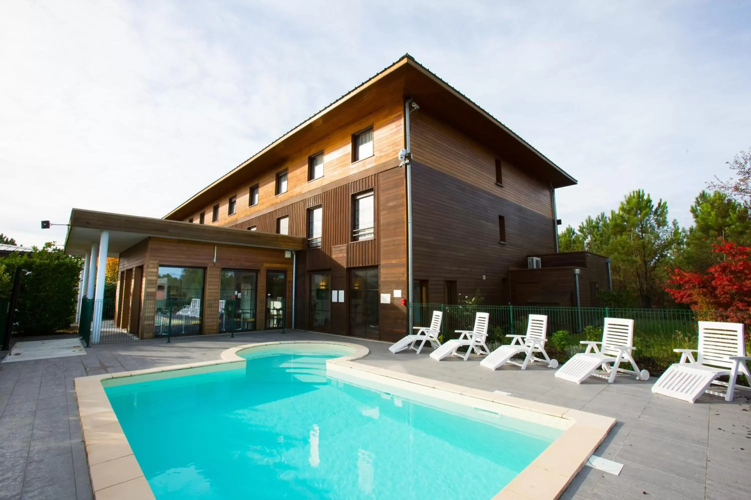 Swimming pool, Property Building in All Suites Le Teich – Bassin d’Arcachon