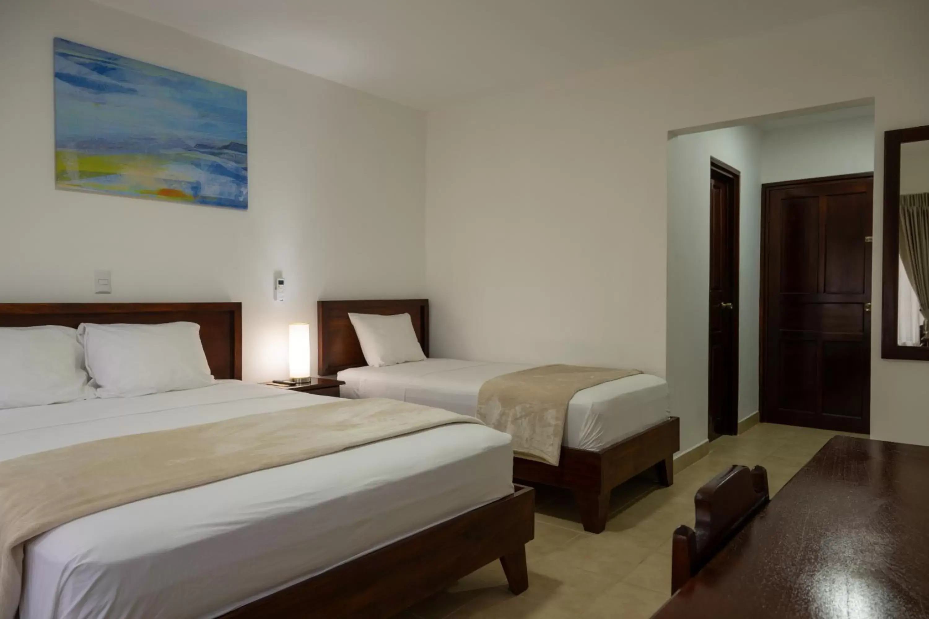Bed in Fuego del Sol Beachfront Hotel