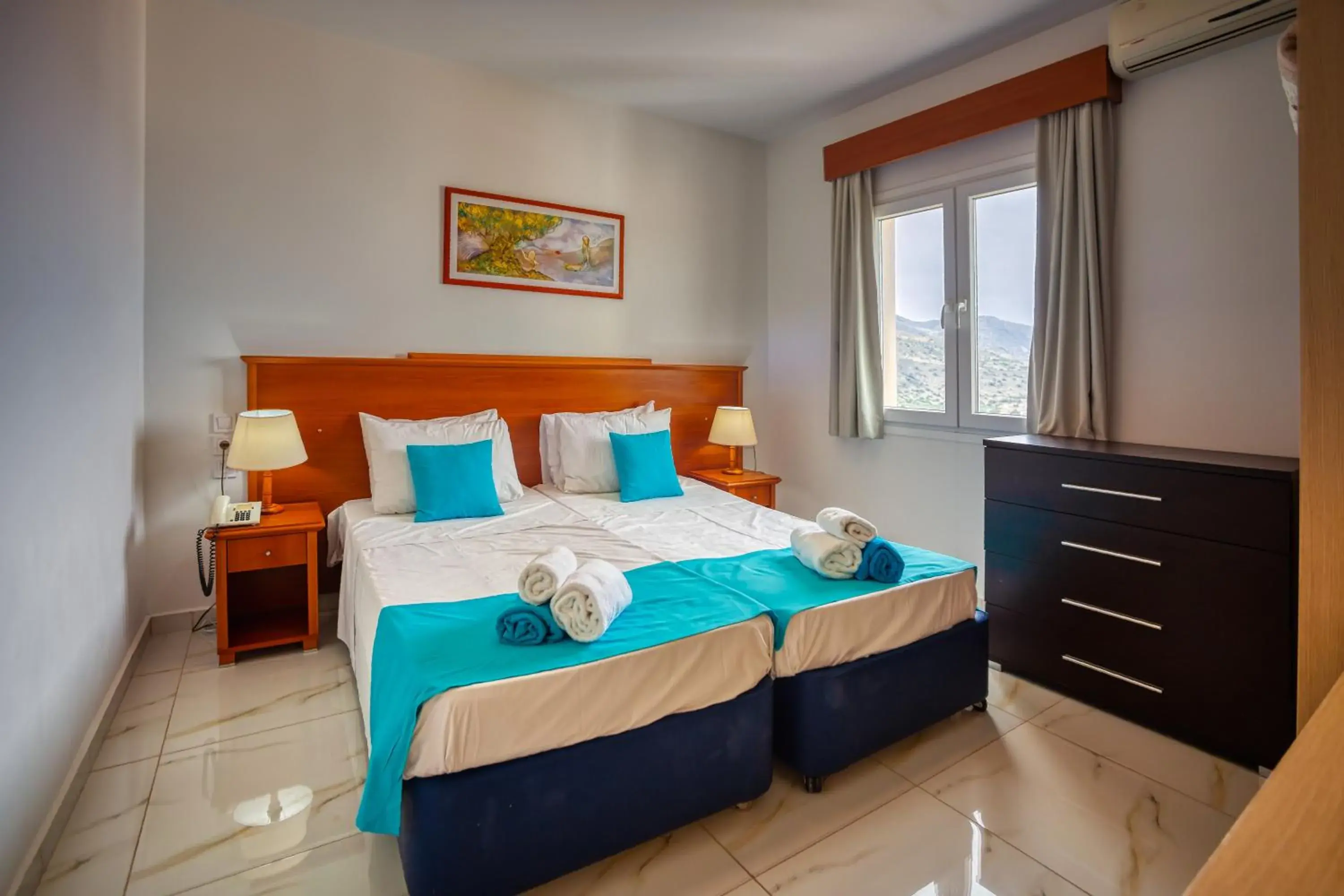 Bed in Elounda Water Park Residence Hotel