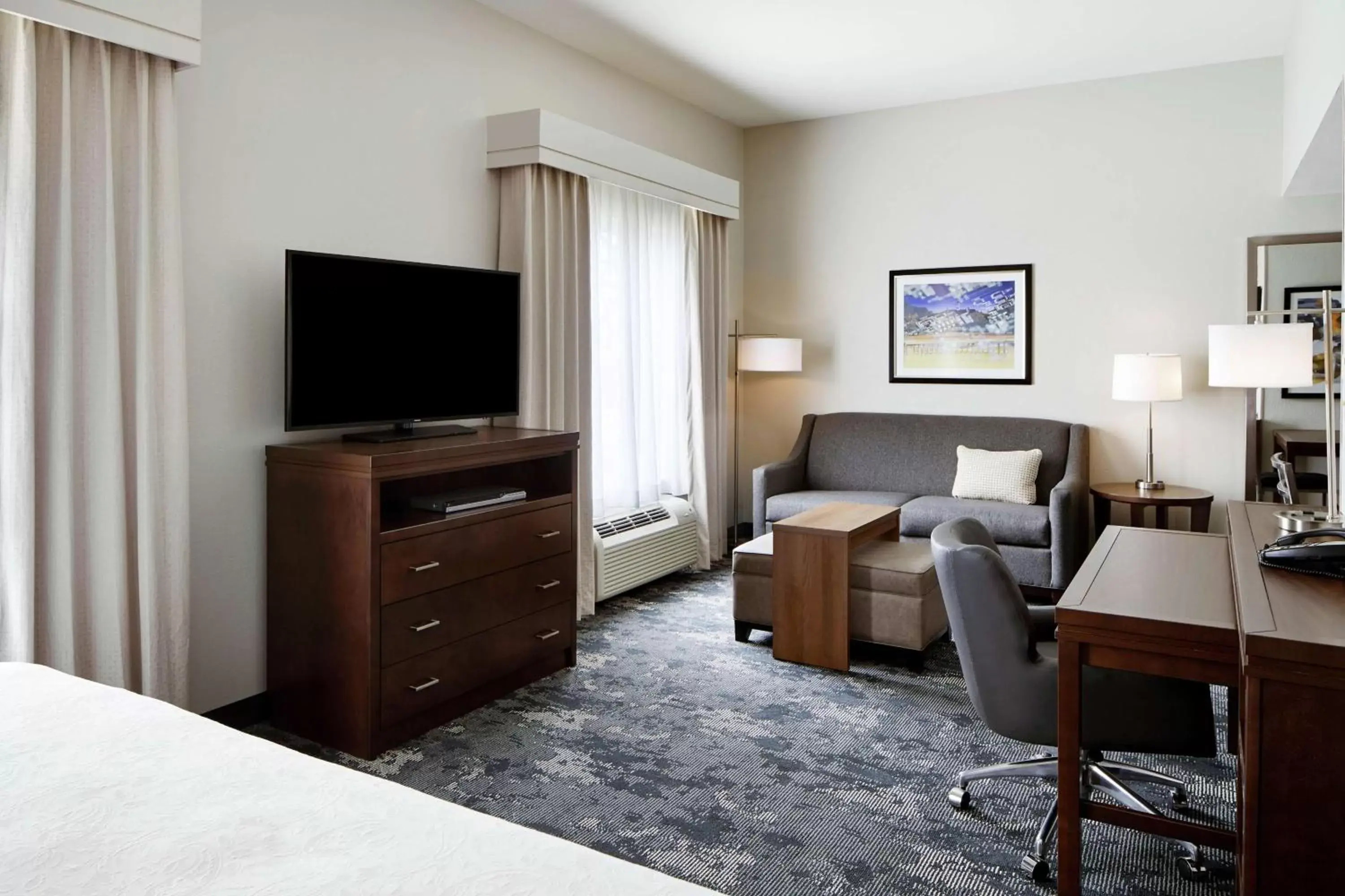 Bedroom, TV/Entertainment Center in Homewood Suites Champaign-Urbana