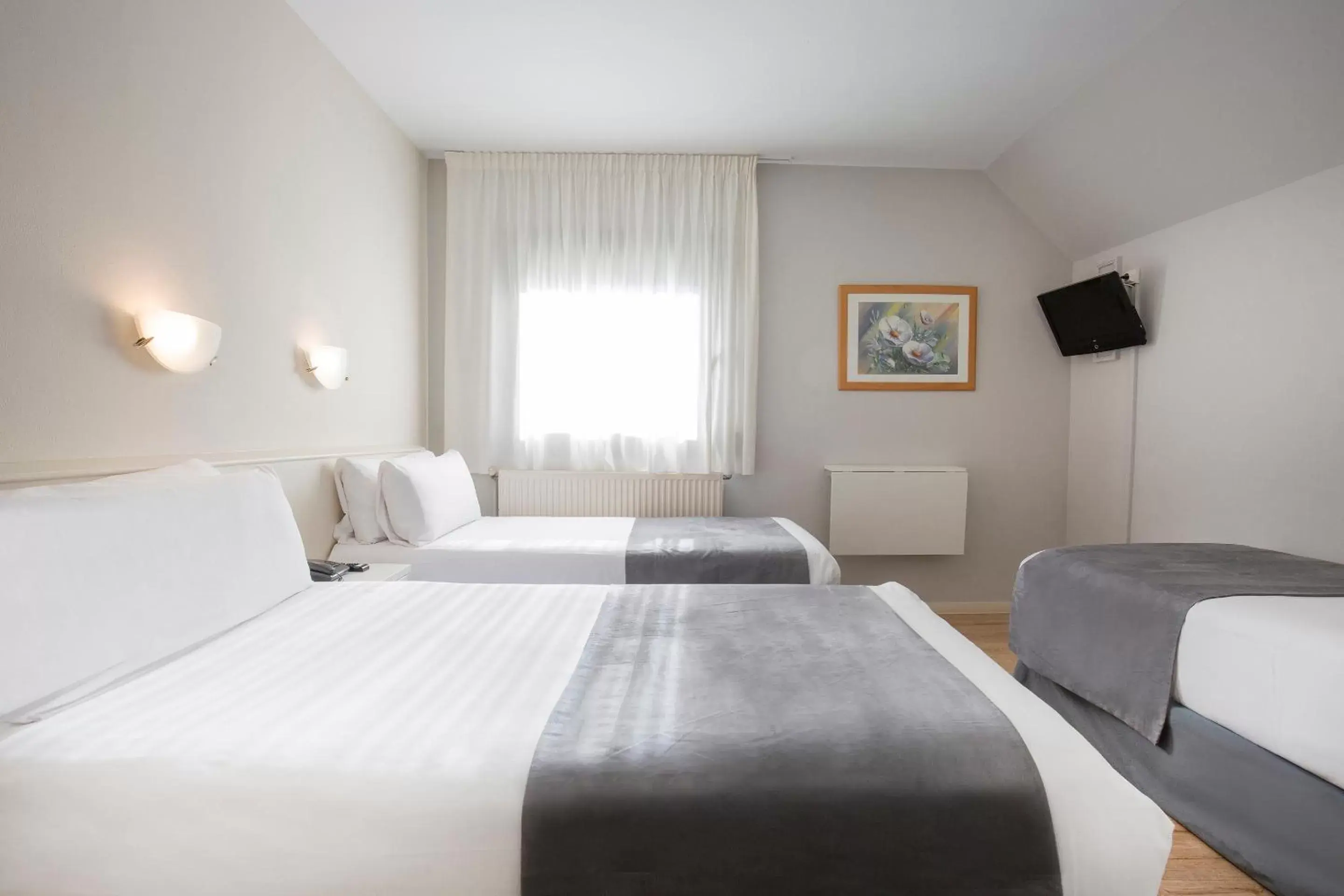 Triple Room in Hotel Camellot by Nexta Triple Room in Hotel Camellot by Nexta