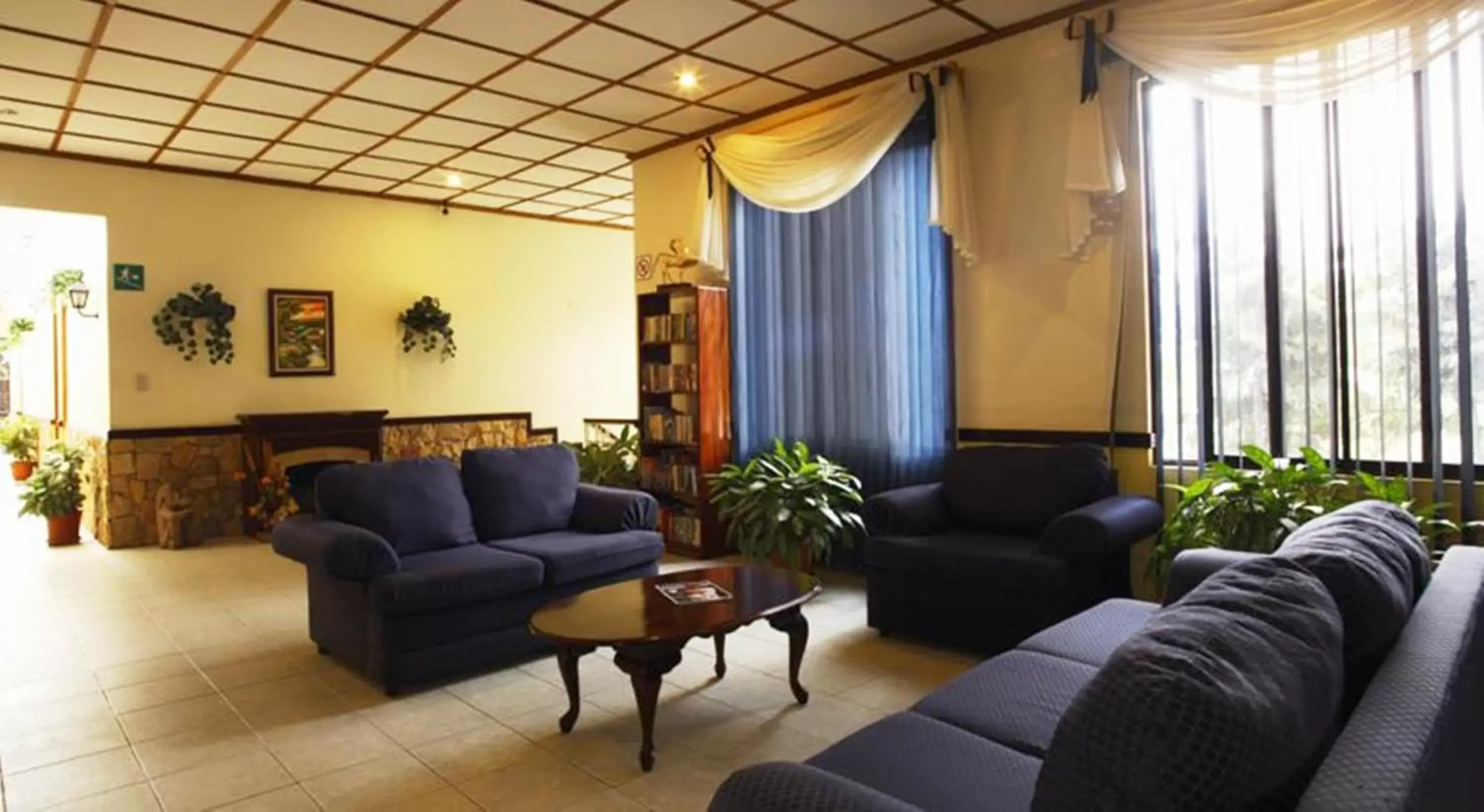 Communal lounge/ TV room, Seating Area in Adventure Inn