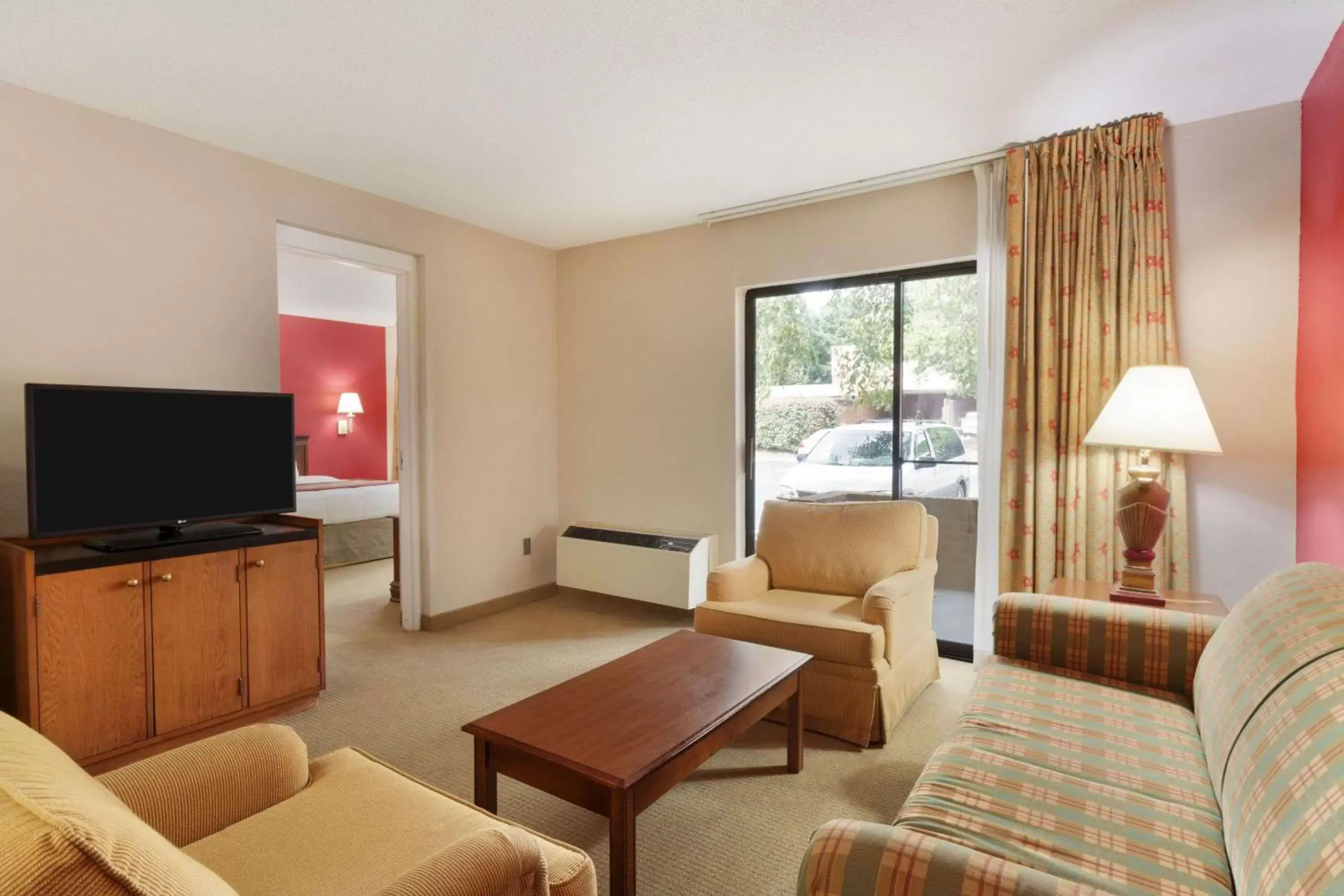 Photo of the whole room, Seating Area in Ramada by Wyndham Raleigh