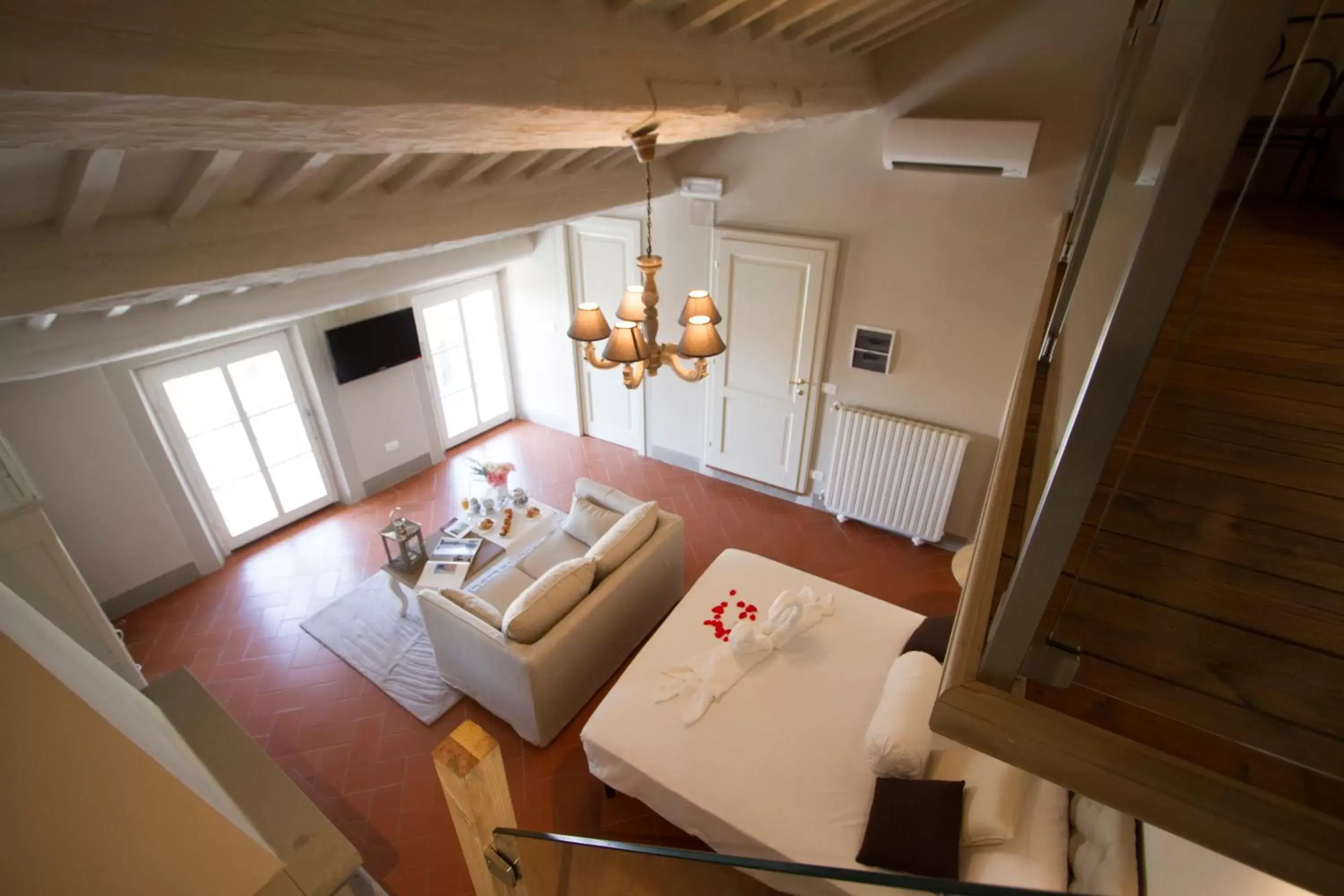Bedroom, Seating Area in Cortona Suite