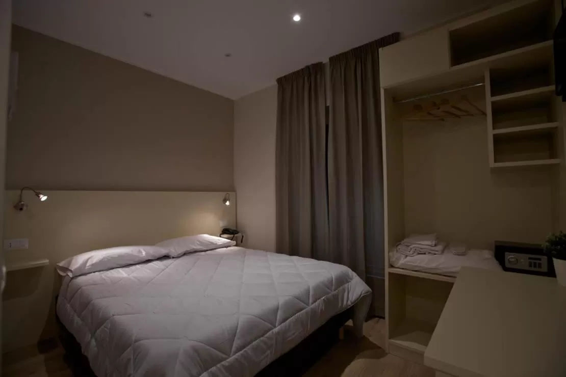 Bed in Onorati Hotel