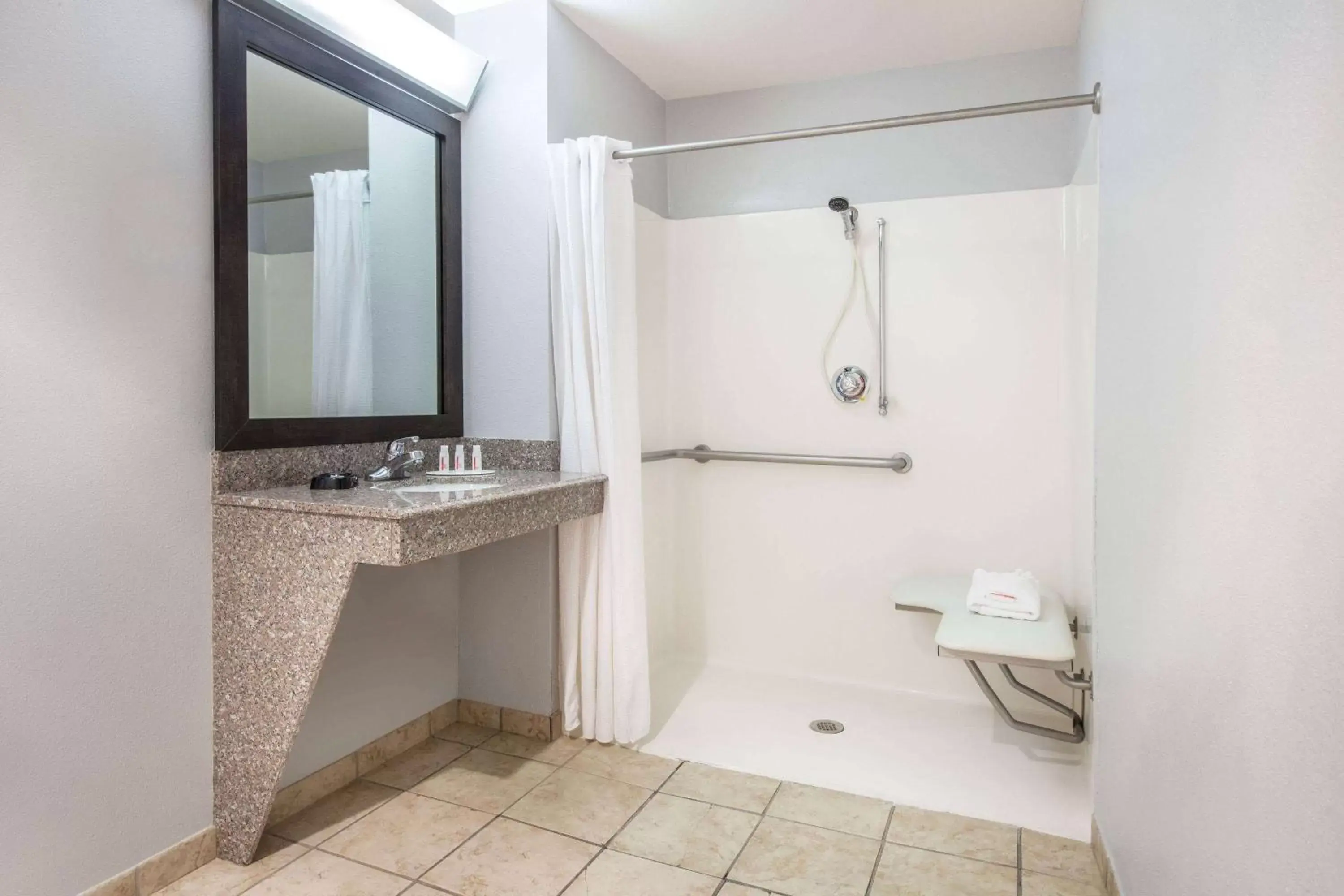 Photo of the whole room, Bathroom in Super 8 by Wyndham Lubbock West