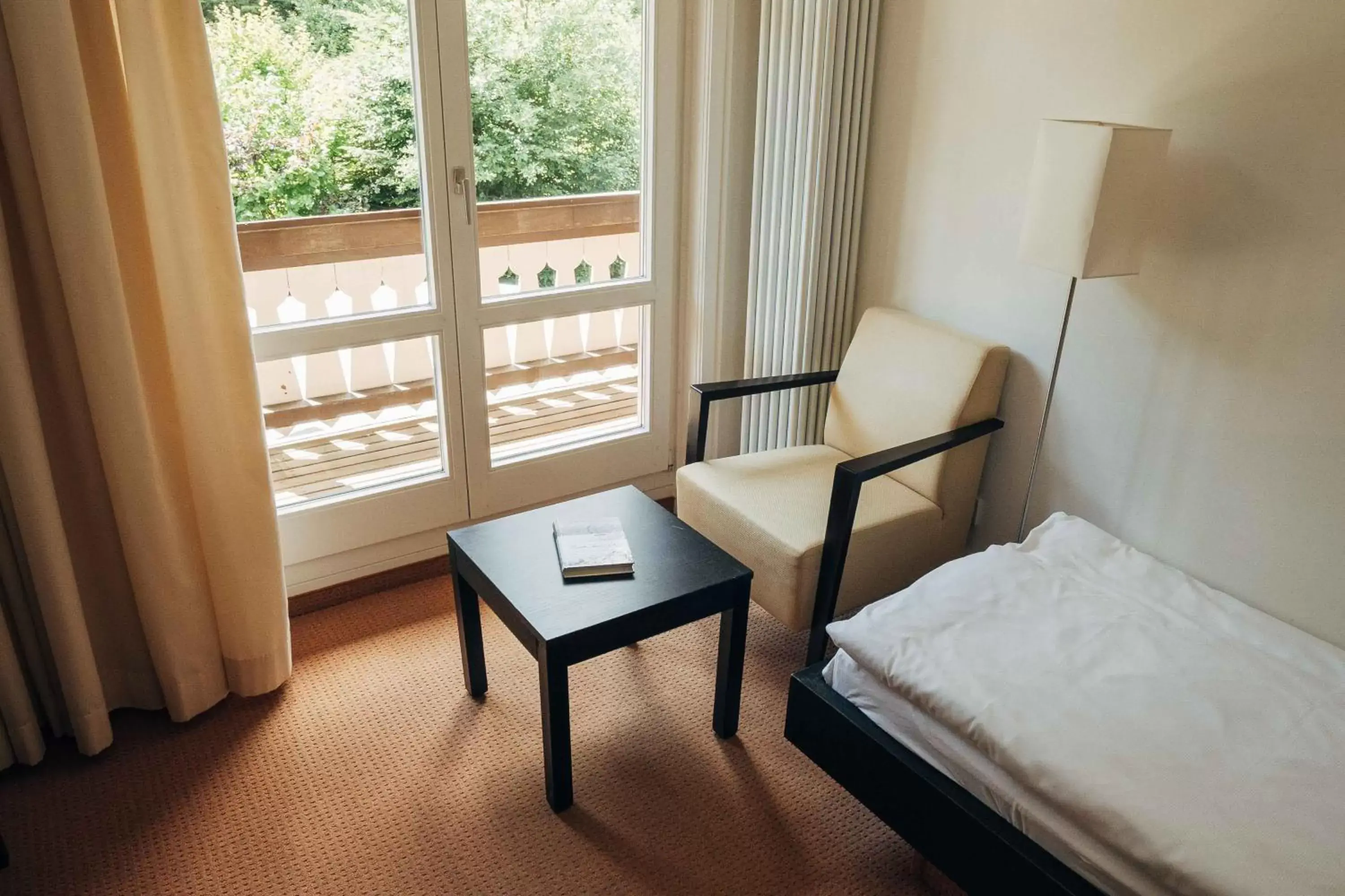 Bed, Seating Area in Fritz Lauterbad