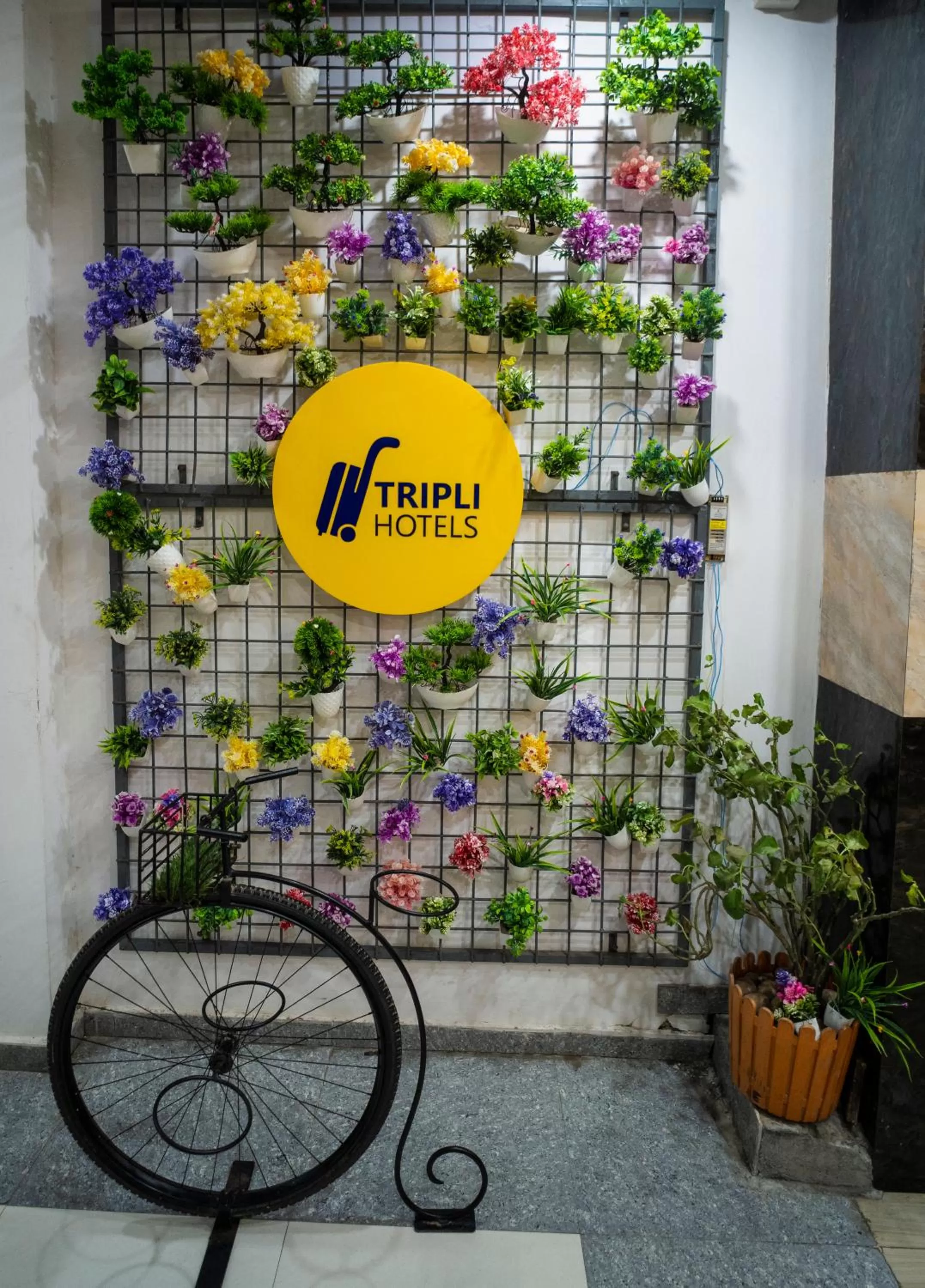 Property logo or sign in Tripli Hotels Arunoday Palace