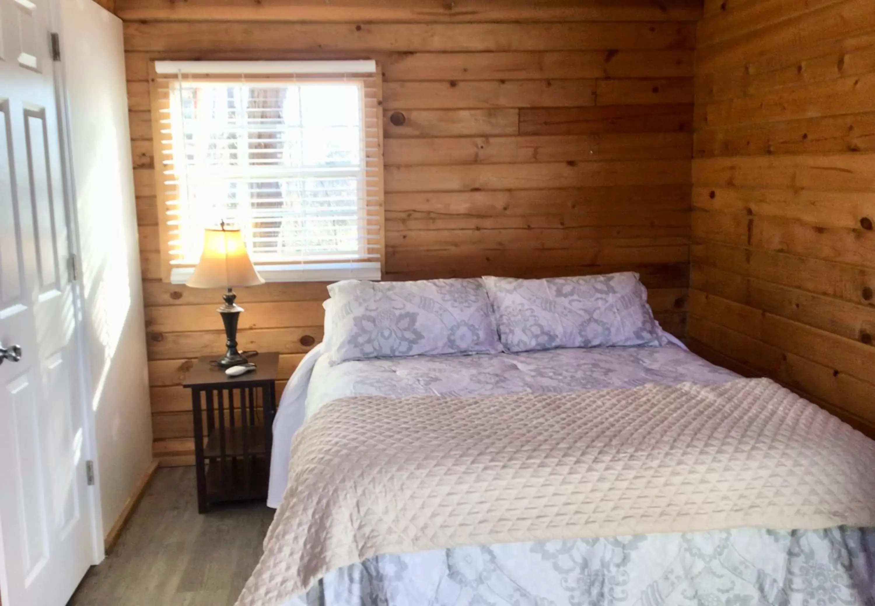 Bed in Kozy Haven Log Cabin Rentals