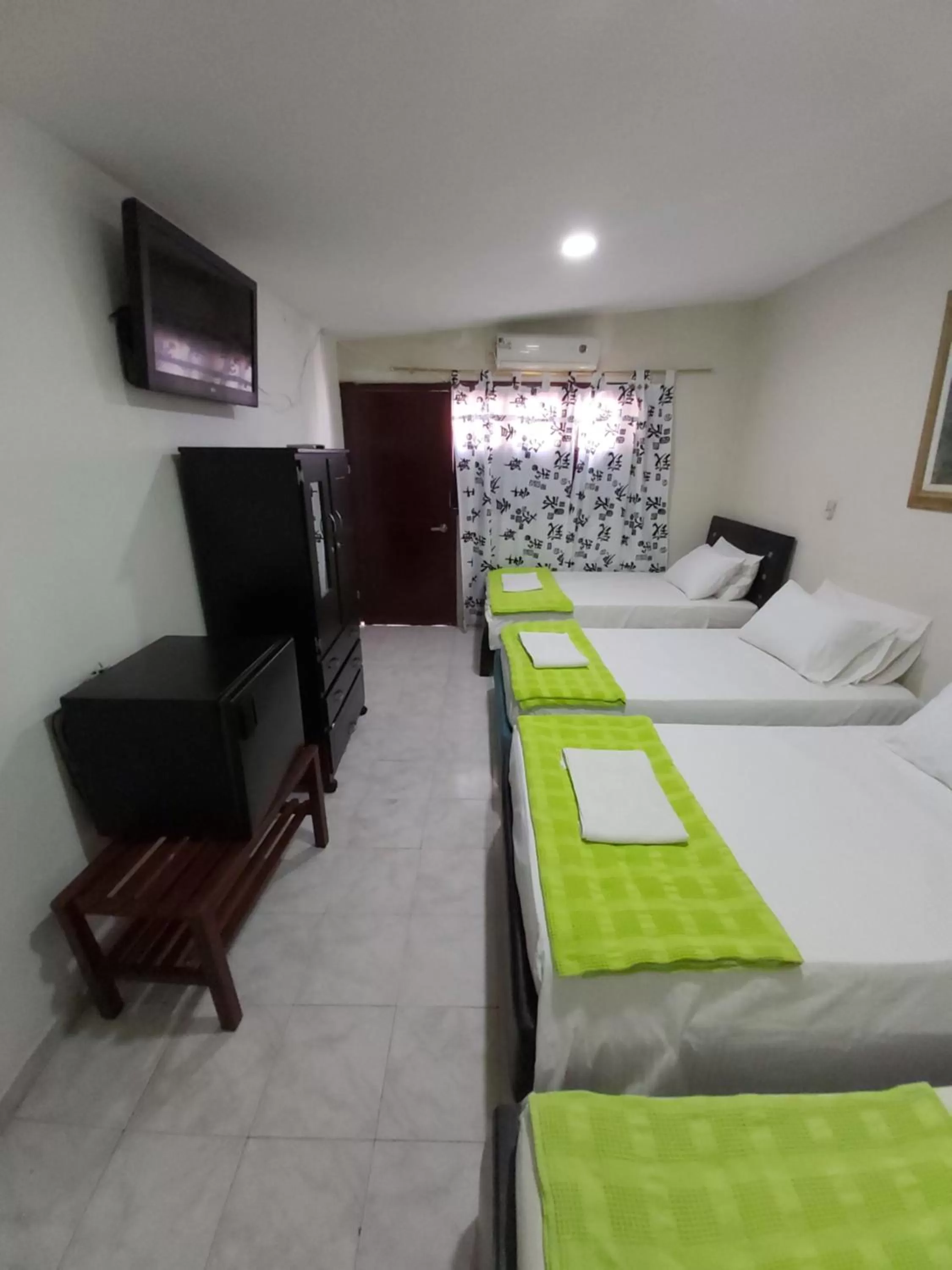 Communal lounge/ TV room, Bed in Eco-Hotel Villa Elina